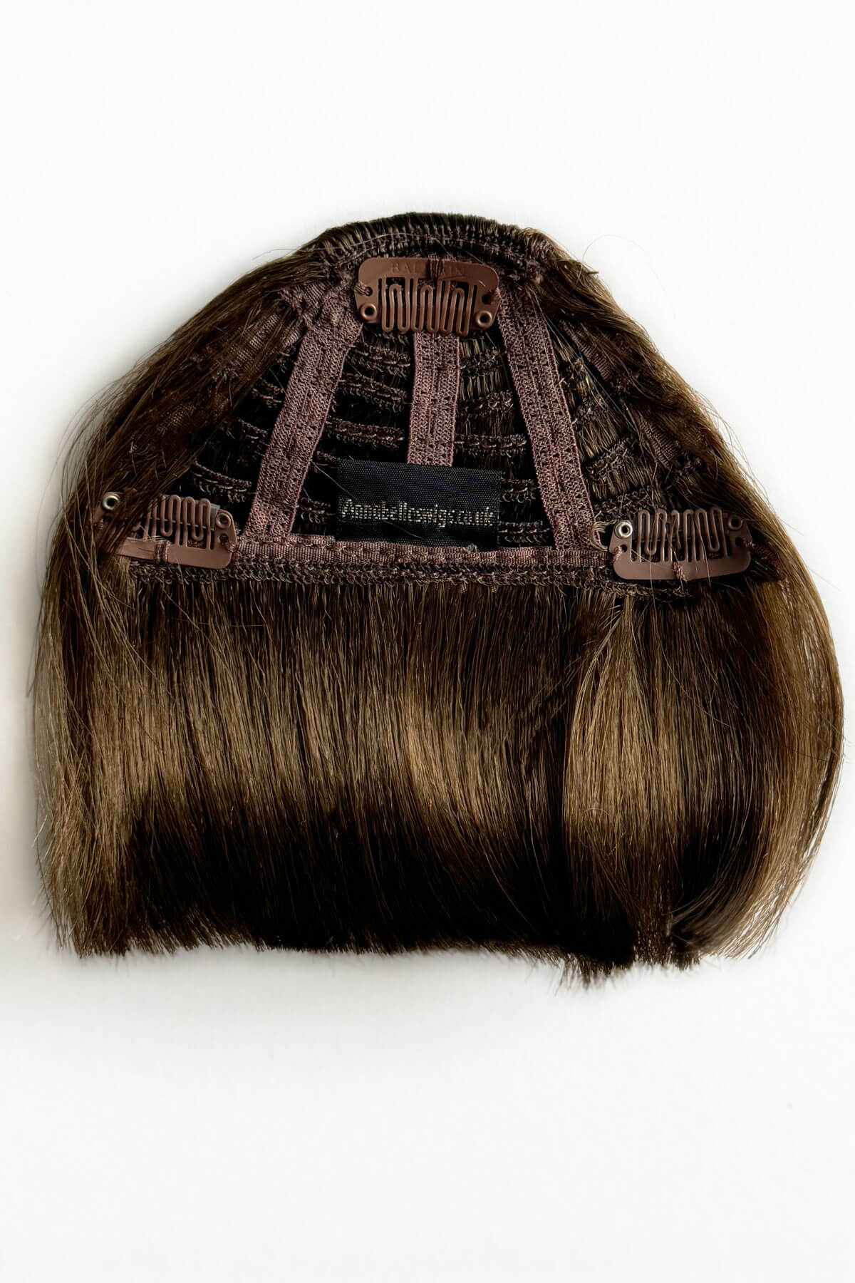 Brown hairpiece with a clip-on design on a white background. Clip-in fringe hairpiece/clip-in micro-bangs, thick, straight retro rockabilly style: Ida brown 10