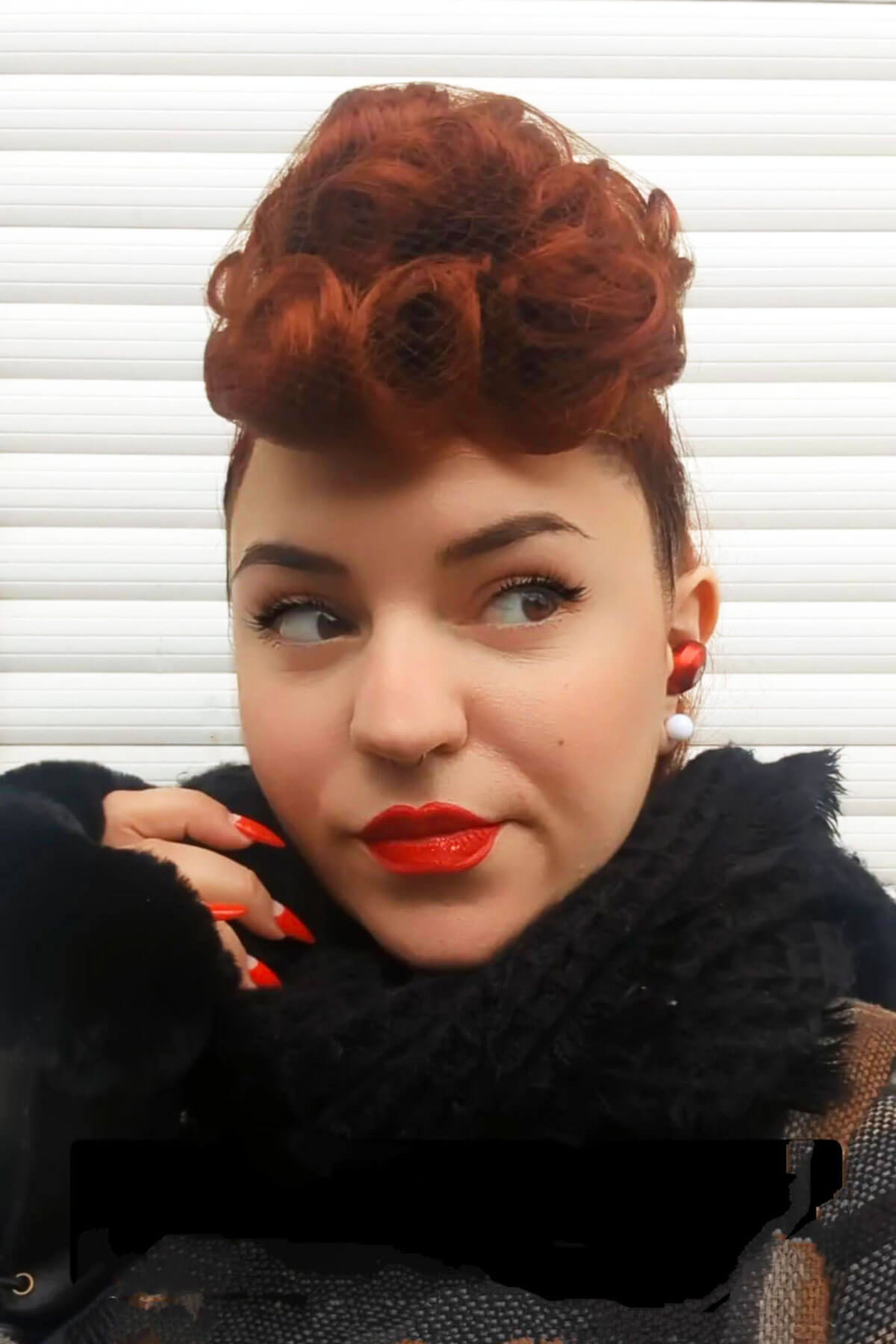 Woman with red hair styled in vintage fashion against a white background. Hair poodle clip-in hairpiece bun vintage style 1950s: Lucille copper red 130