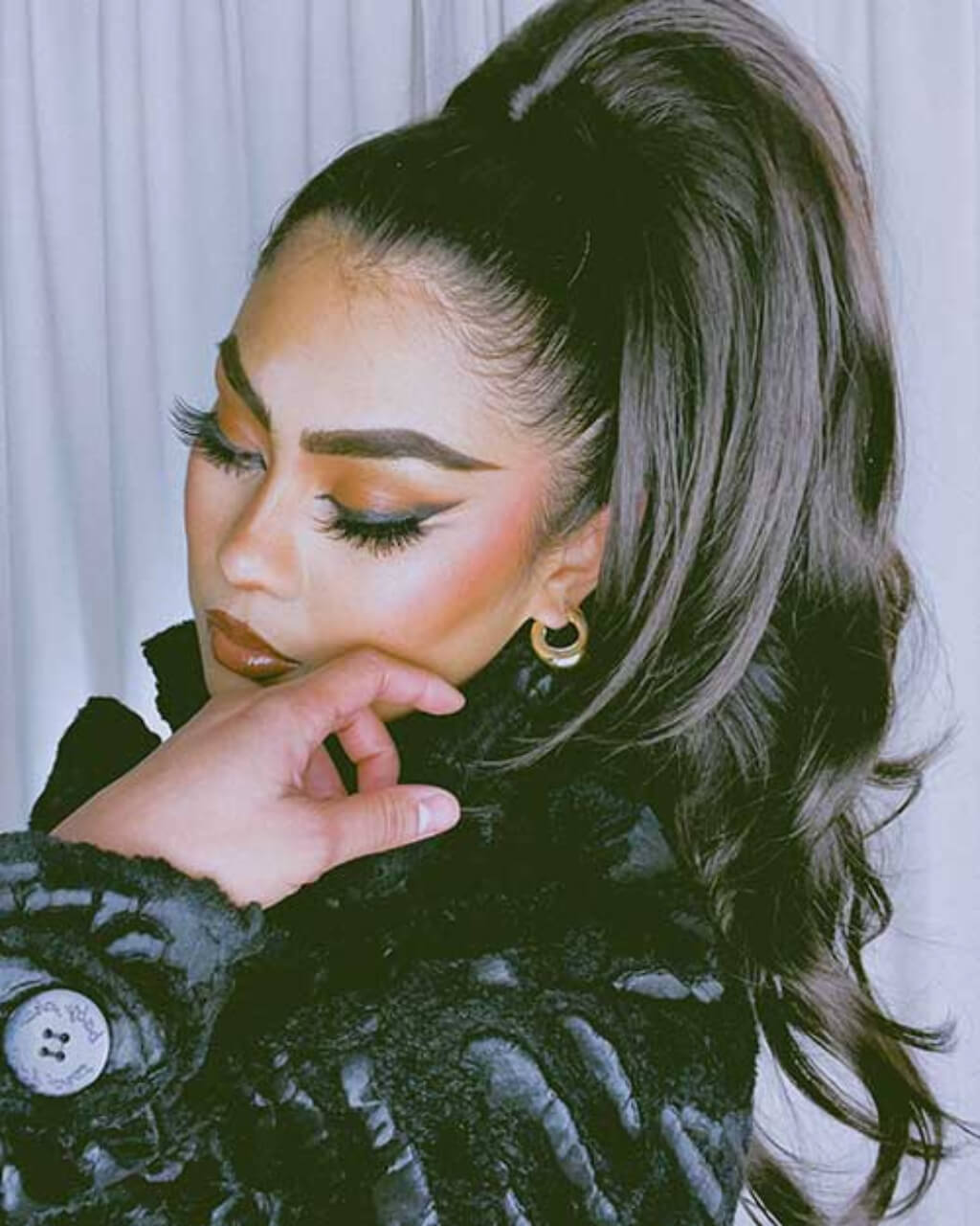 Woman with styled hair and makeup. Clip-in ponytail hairpiece extension: Olivia dark brown 4
