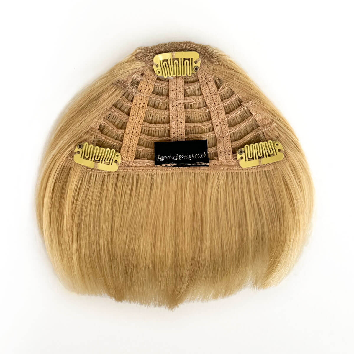 Blonde hair extension with a gold clip on a white background. Clip-in fringe hairpiece/clip-in micro-bangs, thick, straight retro rockabilly style: Ida creamy blonde 613