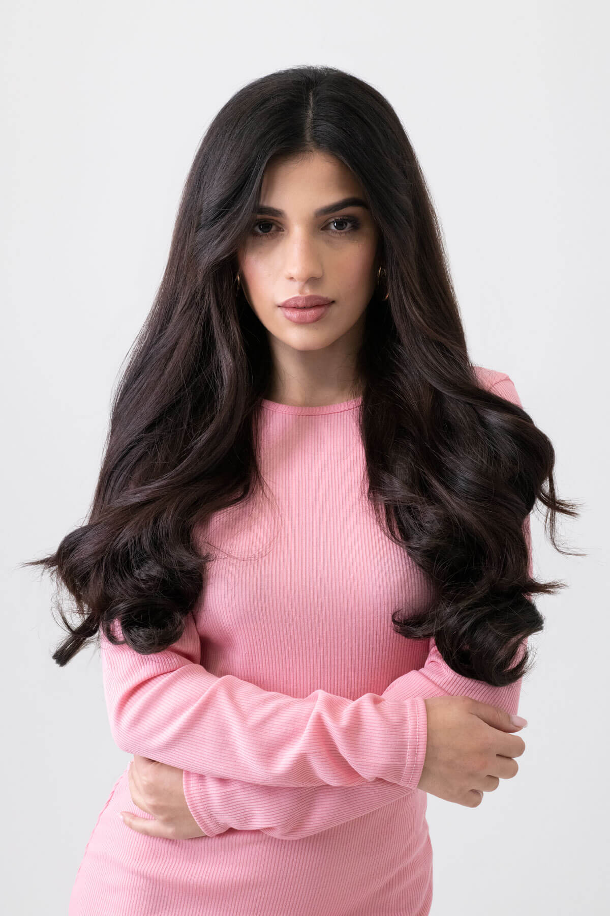 Woman wearing a pink dress with long, wavy hair against a light background. synthetic hair extension, 1 piece, wavy, 20", 200g dark brown 4