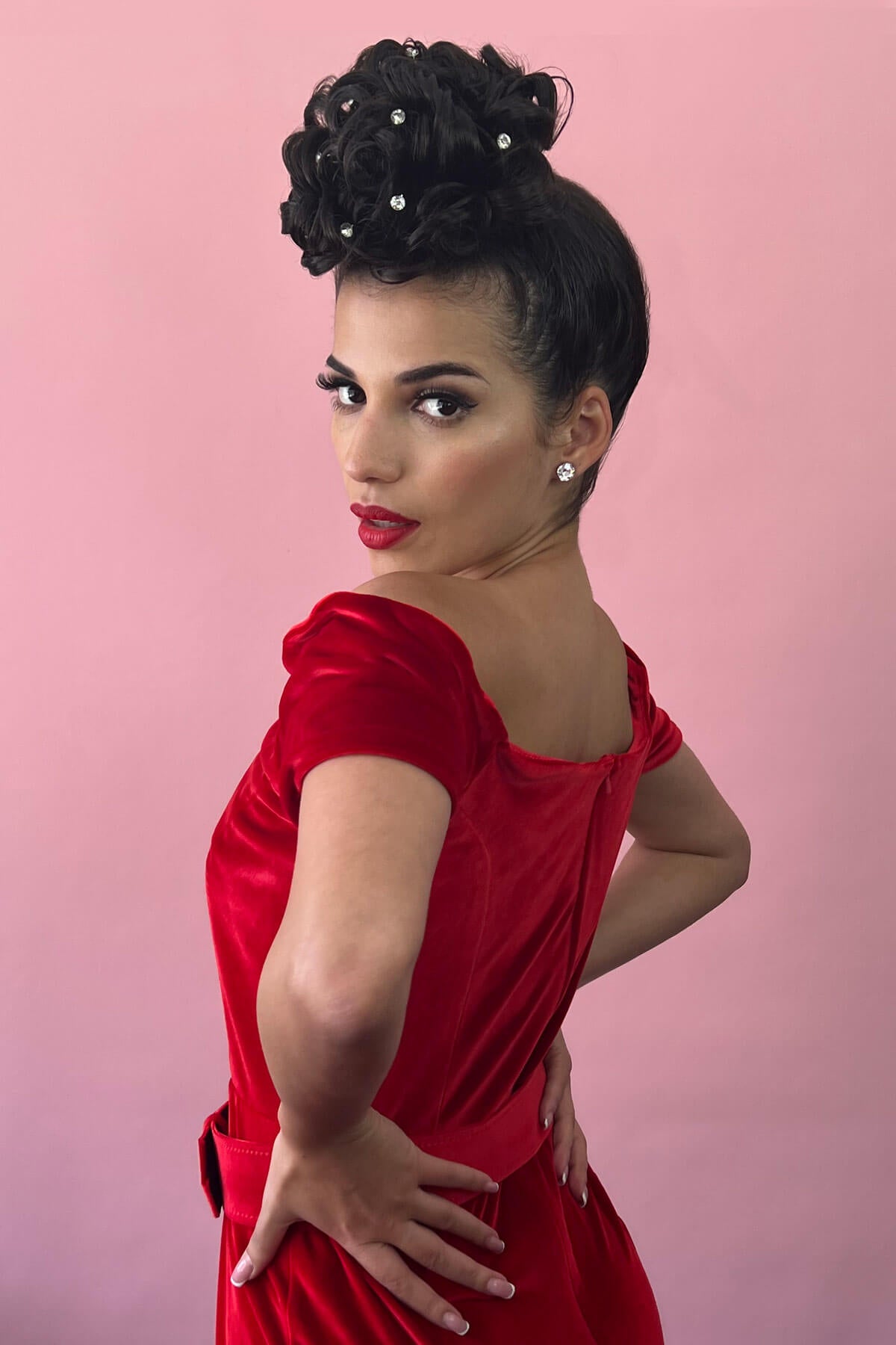 Woman in a red dress with a pink background. Hair poodle clip-in hairpiece bun vintage style 1950s: Lucille chestnut brown 8