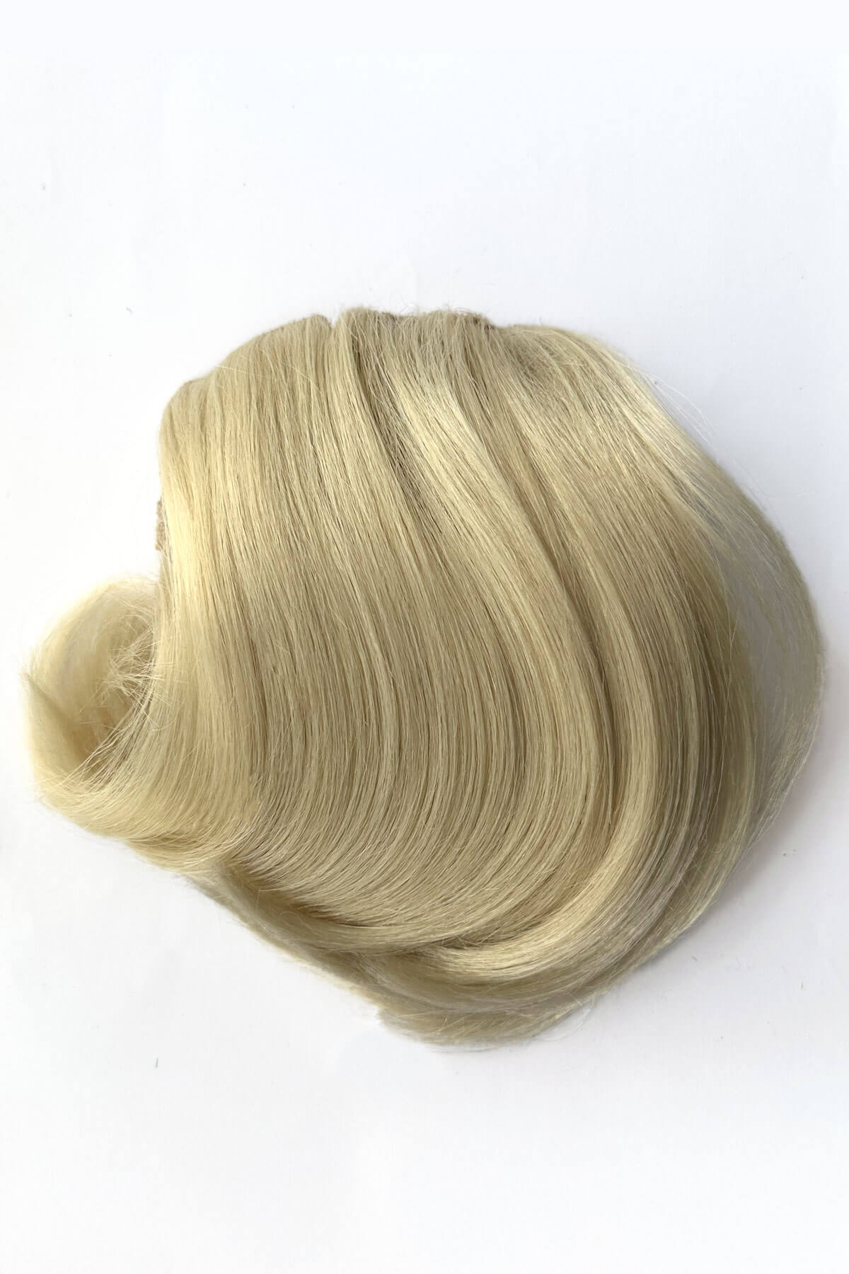 Blonde hairpiece on a white background. Beehive hairpiece hair height booster, Flexihair: Pixi creamy blonde 613