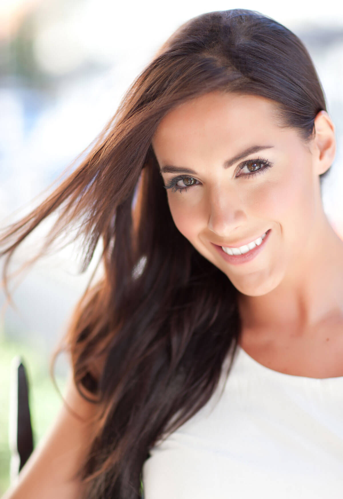 Woman with long brown hair smiling outdoors. Extension hairpiece, long, versatile, Flexihair: Cristina dark chocolate brown 6