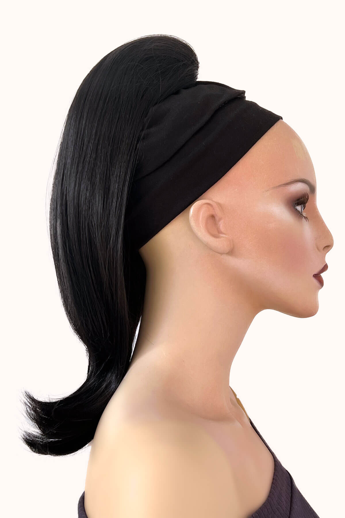 Black headband with a black ponytail on a mannequin head against a white background. Long ponytail hairpiece, straight with flick: Clarisa black 1B