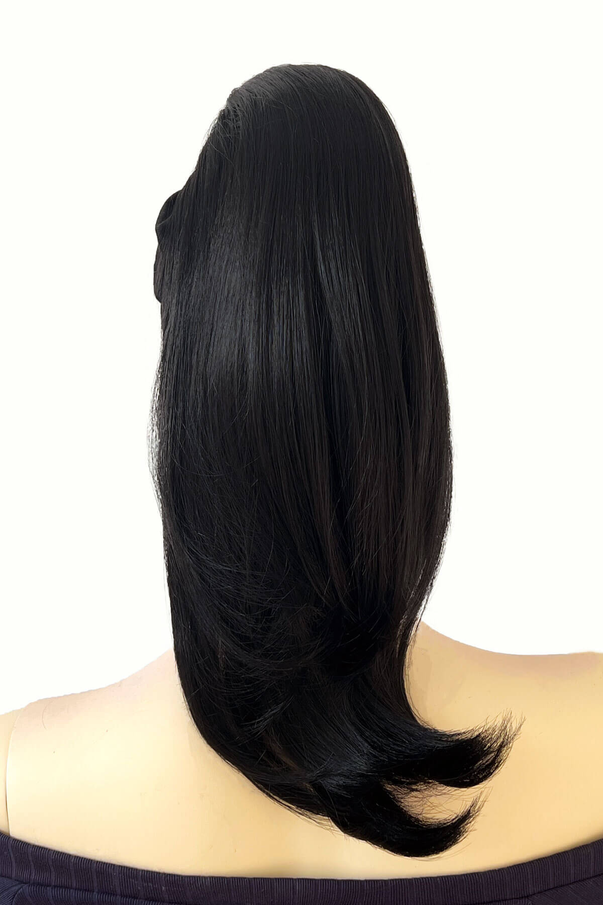 Black hair extension styled on a person's head against a white background. Long ponytail hairpiece, straight with flick: Clarisa black 1B