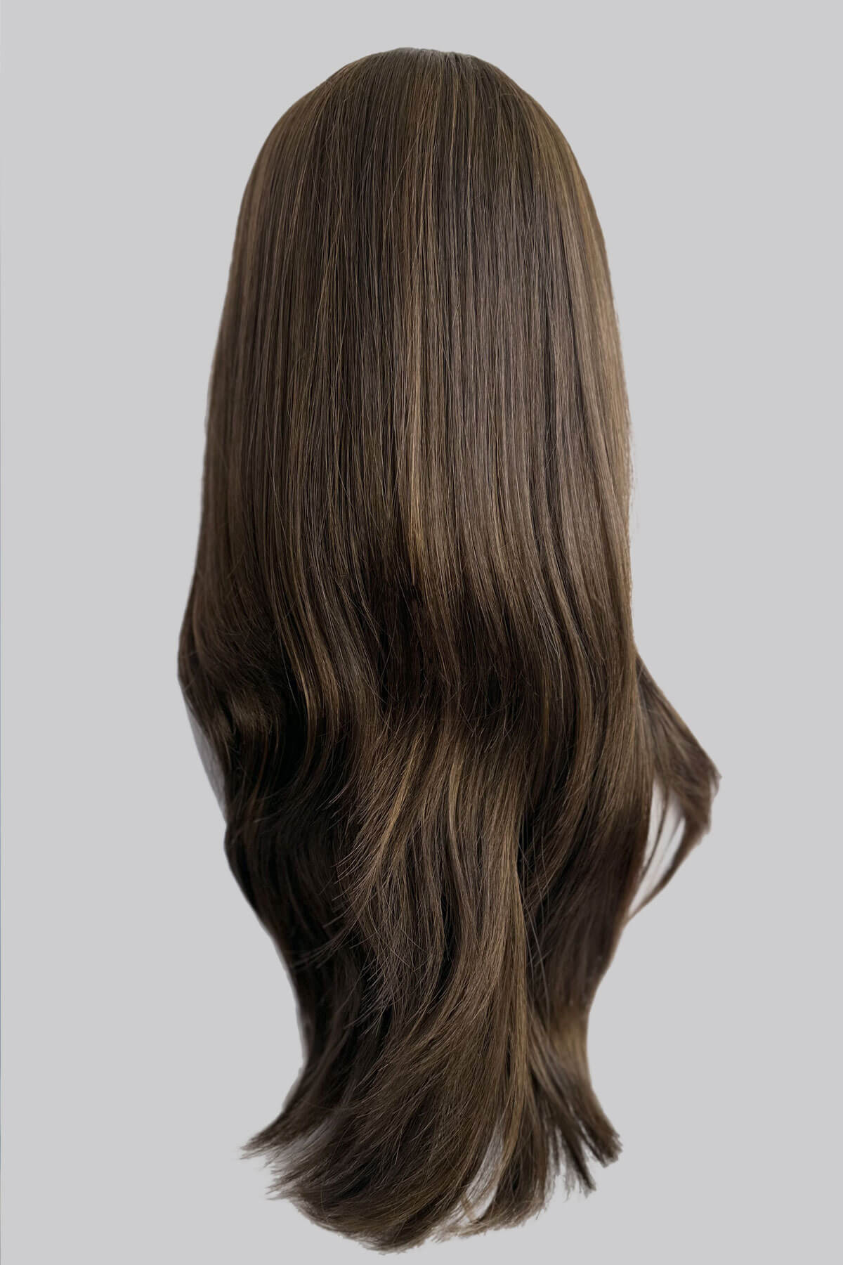 Brown wig on a white mannequin head against a plain background. Brown half wig hairpiece, layered and straight: Summer brown with blonde highlights 8H27