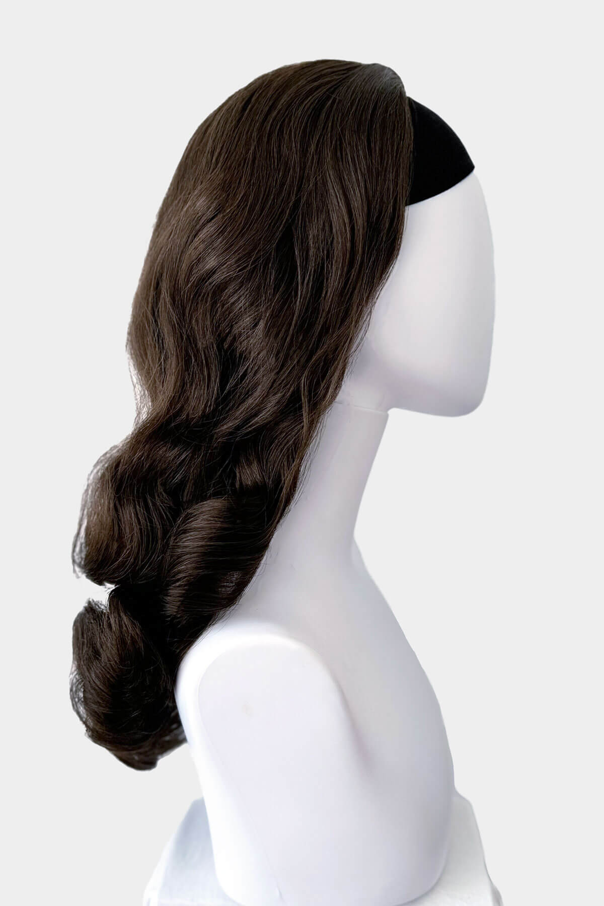 Chestnut brown wig on a mannequin head against a white background. 1950s style half wig hairpiece with beautiful waves: Morgana chestnut brown 8