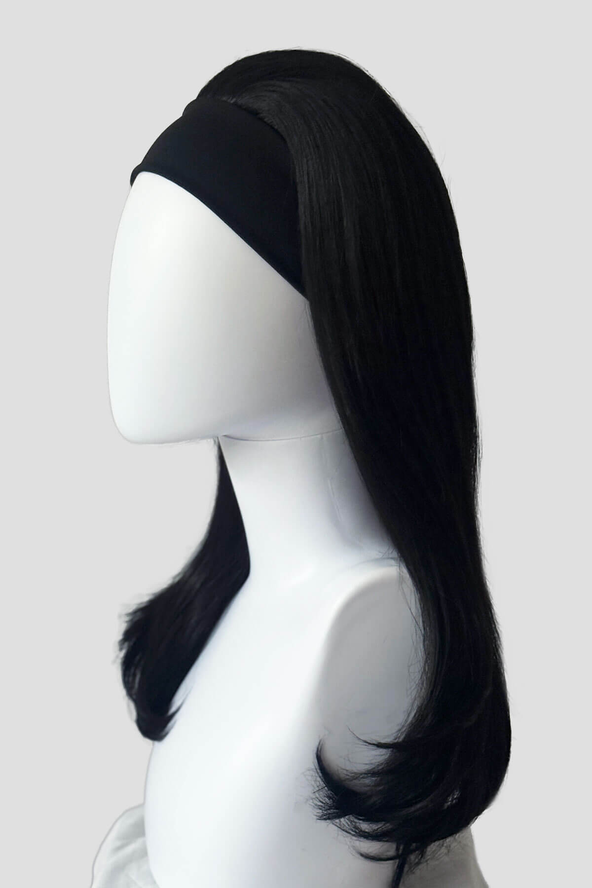 Black wig on a mannequin head against a plain background. Headband half wig hairpiece, long and straight: Isla black 1B