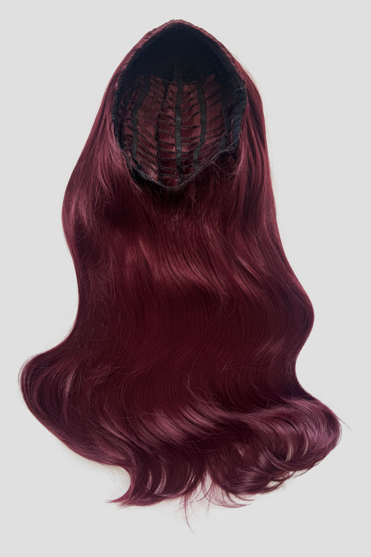 Red wig with a black spider-like design on a white background. Heat Styleable Extra Long, Gentle Wave Half Wig red 39