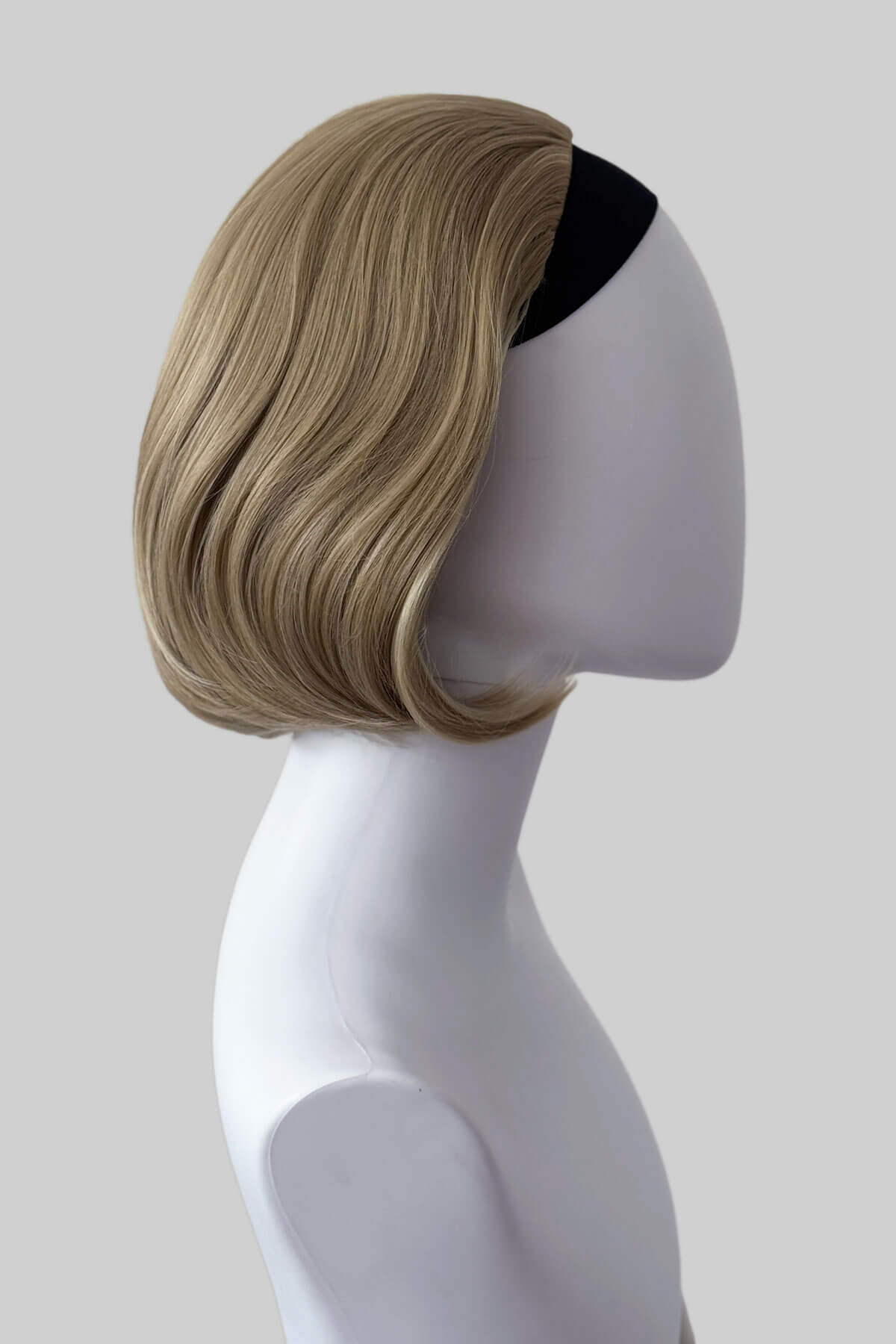 Mannequin head with a blonde wig on a plain background. Bob half wig hairpiece, Flexihair: Amelie blonde 24H613