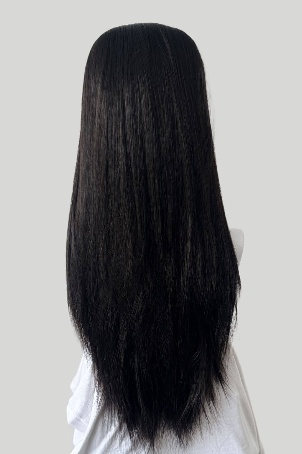 Dark brown wig on a mannequin head against a plain background. 1960s style hair, high crown long straight half wig: Andrea Dark brown 4