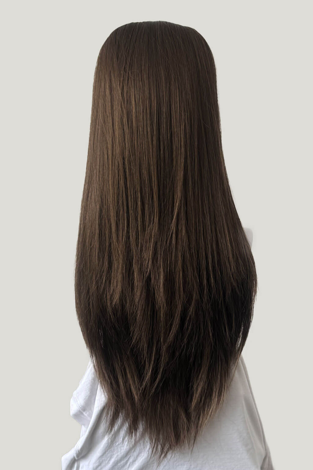 Mannequin head with long brown hair on a white background. 1960s style hair, high crown long straight half wig: Andrea mocha brown 10