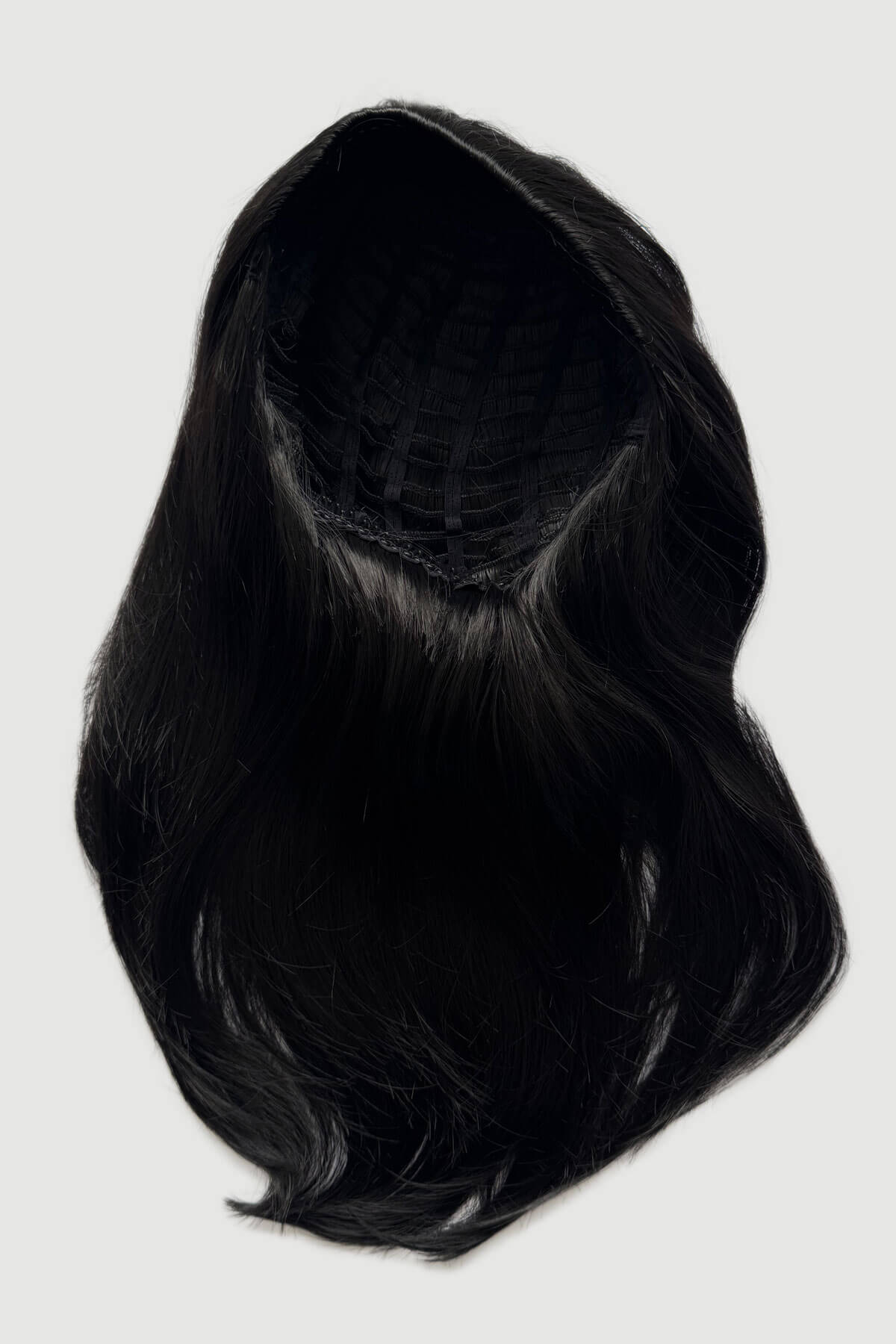 Black wig on a white background. Straight black half wig hairpiece, layered: Cerys
