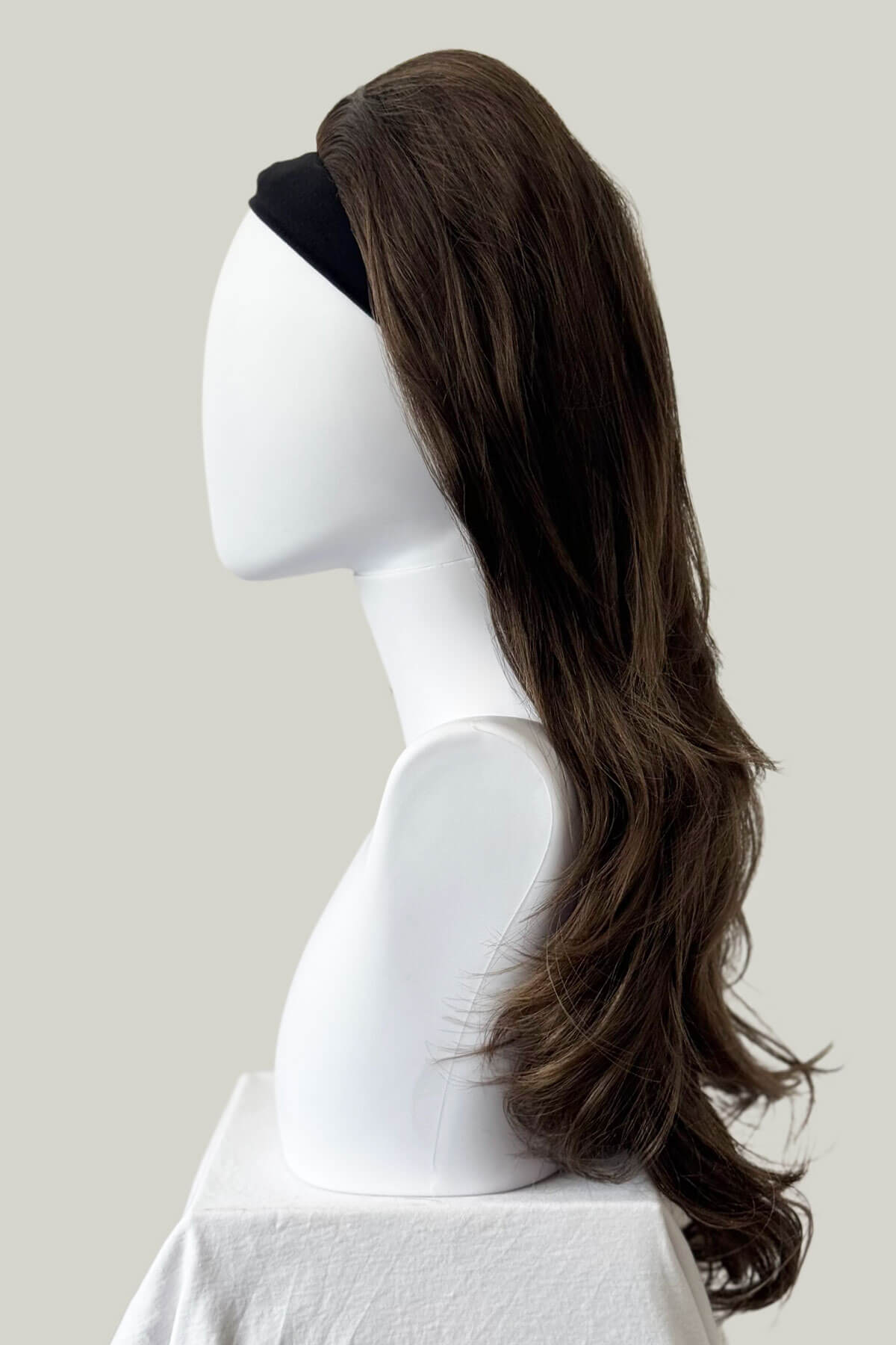 Brown wig on a mannequin head against a plain background. High crown long, layered half wig and volume ring: Helena brown and blonde 10T6