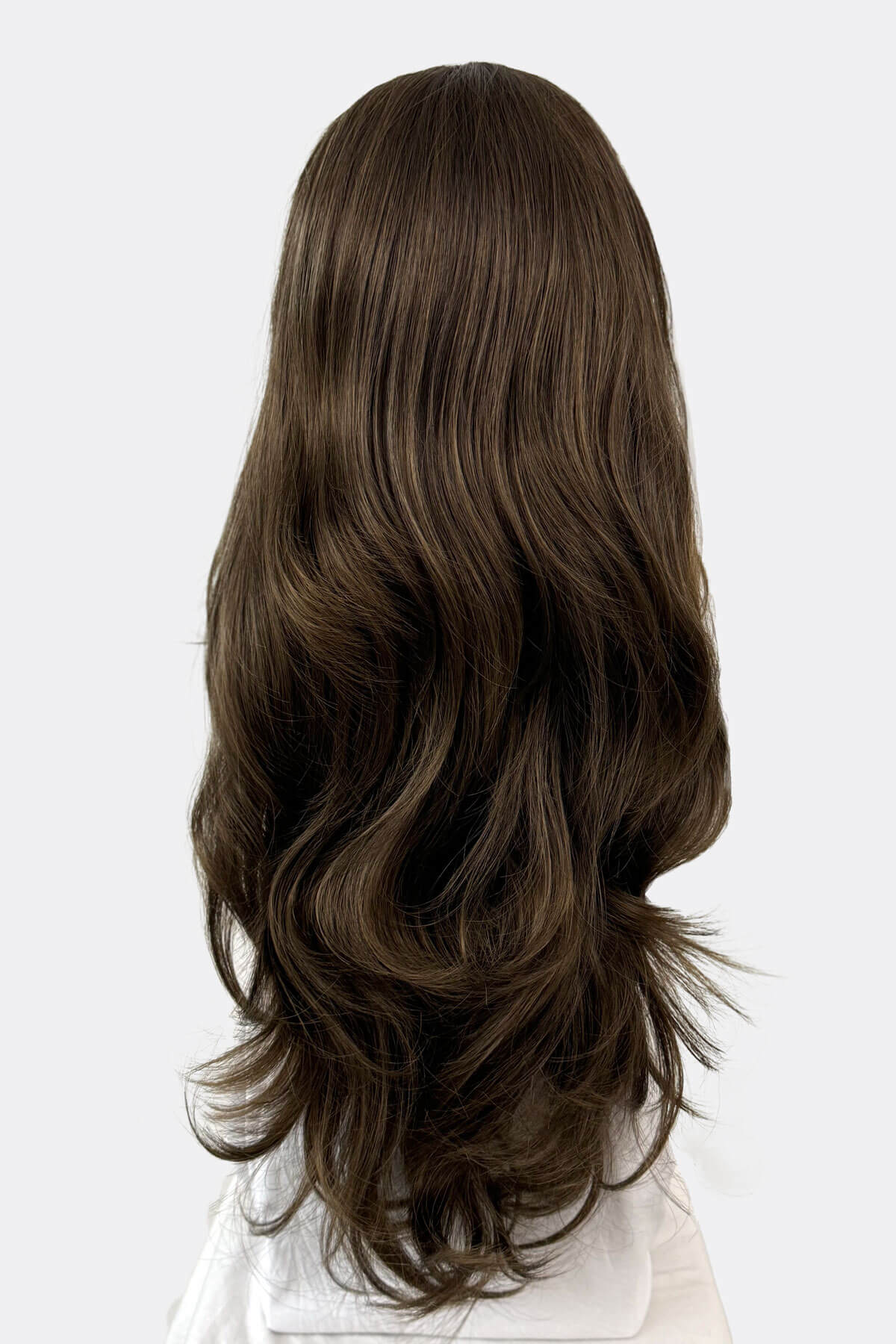 Long brown wig on a white background. Two-tone brown half wig hair piece, loose curls: Laila