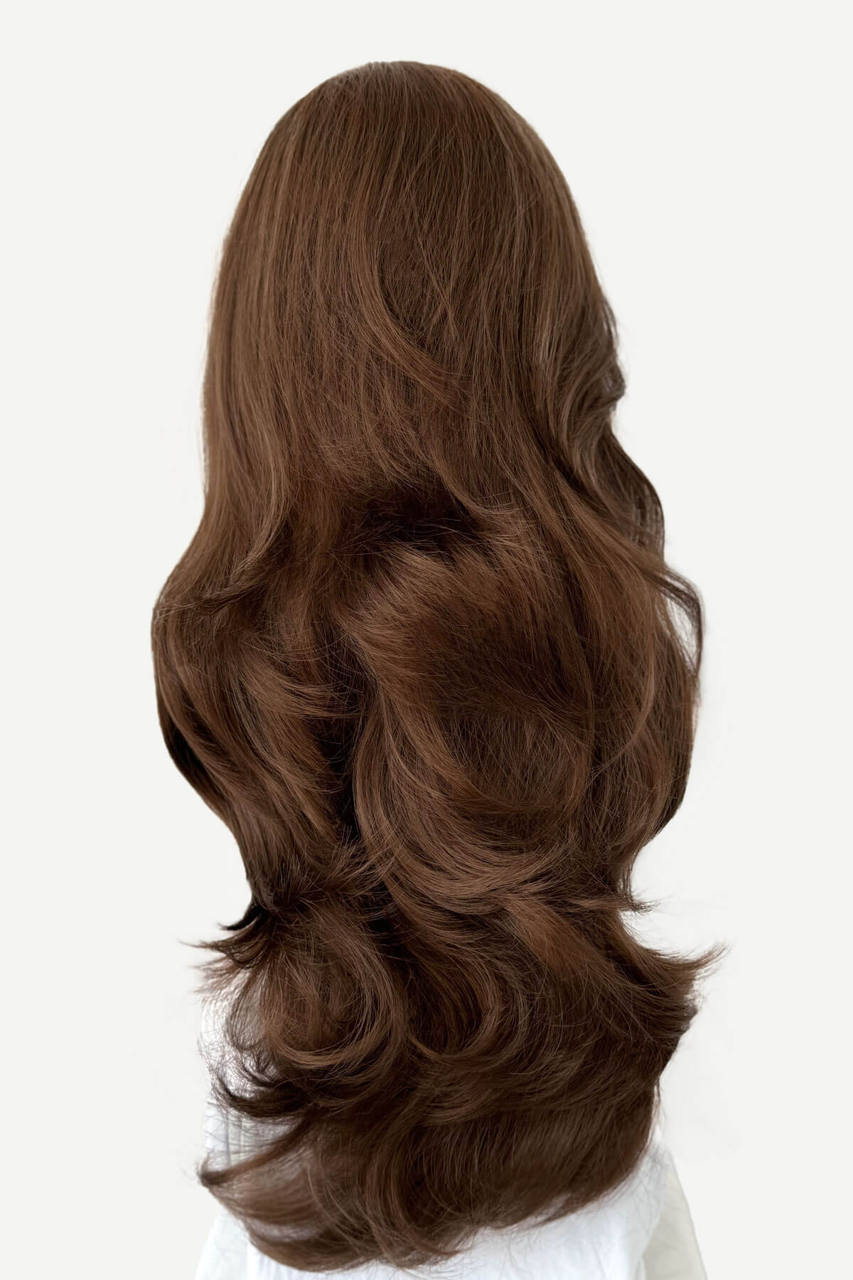 Brown wig with wavy hair on a white background. Brown half wig hairpiece (3/4 wig), layered, wavy: Simone light brown 12