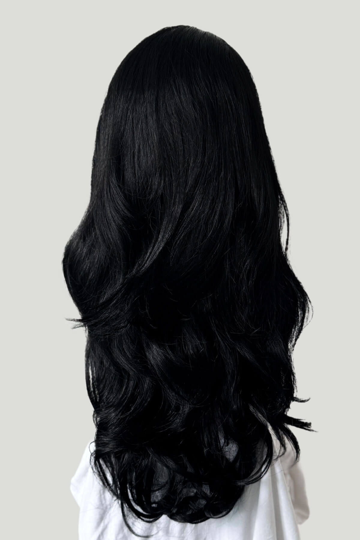 Black wig on a plain background. Black 3/4 hairpiece (half wig) with long waves: Jessie jet black 1