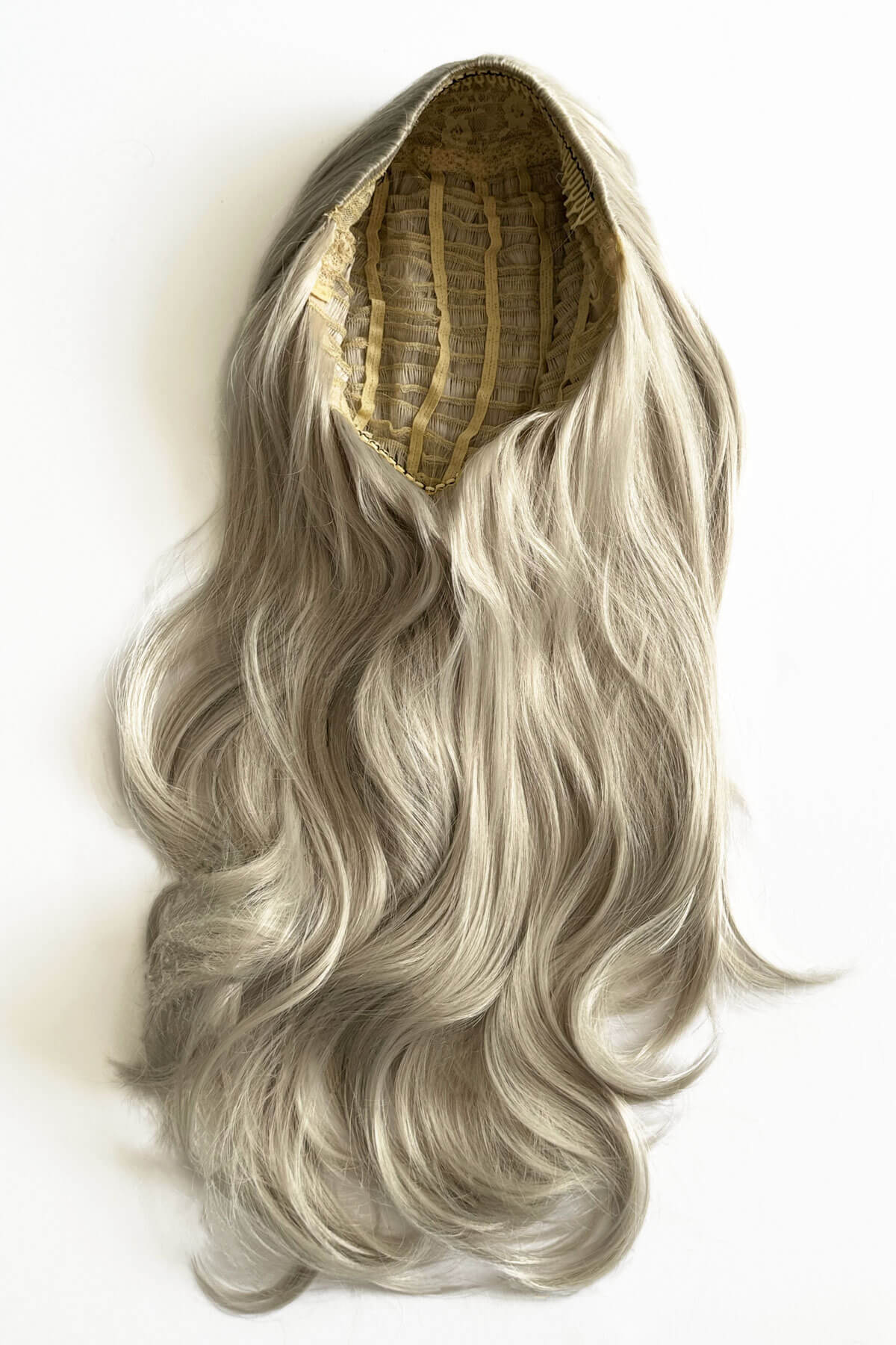 Gray wig with a white background. Silver half wig hairpiece (3/4 wig), loose curls: Tahlia