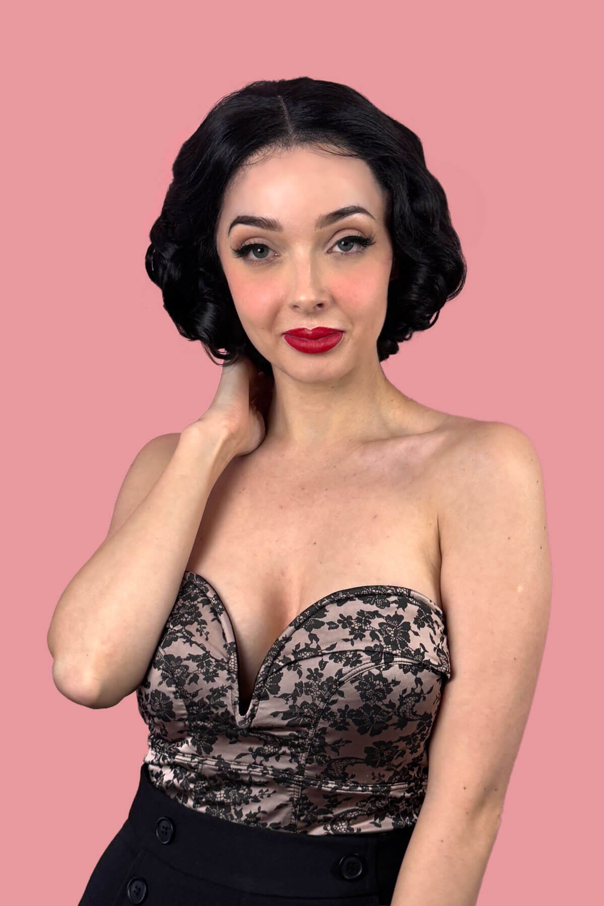 Woman with short black waved hair. Black pinup wig, lace front, vintage style: Halle