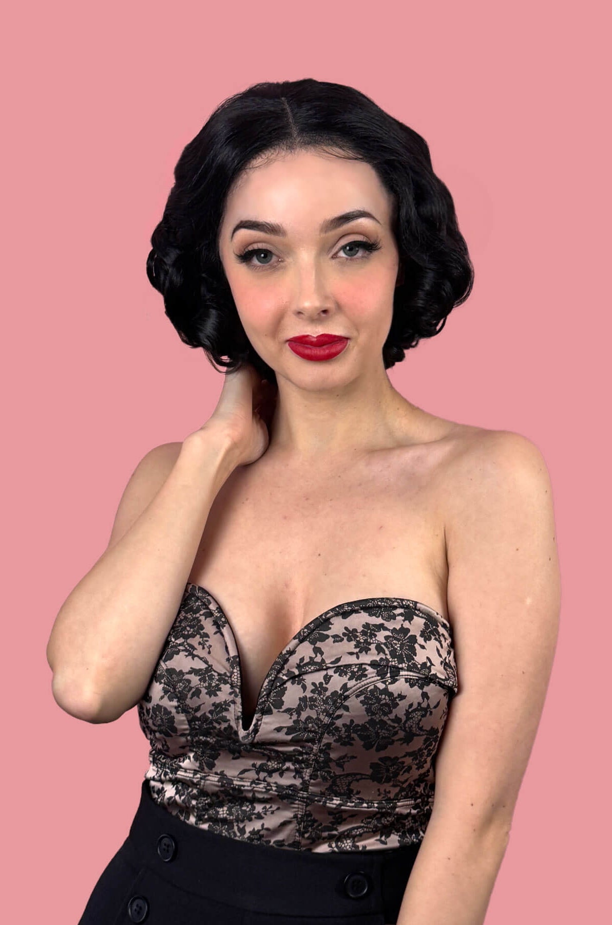 Woman with short black waved hair. Black pinup wig, lace front, vintage style: Halle