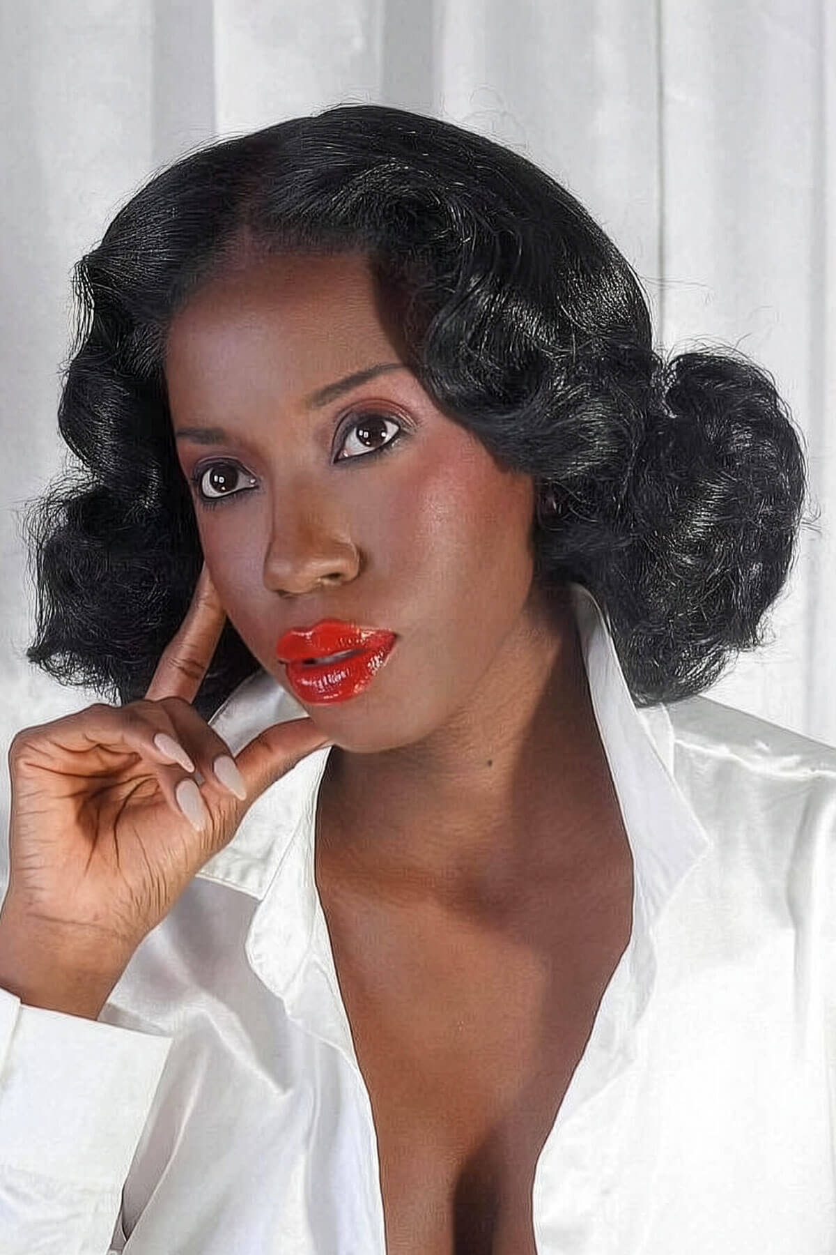 Woman with styled hair and red lipstick against a white background. Black pinup wig, lace front, vintage style: Halle