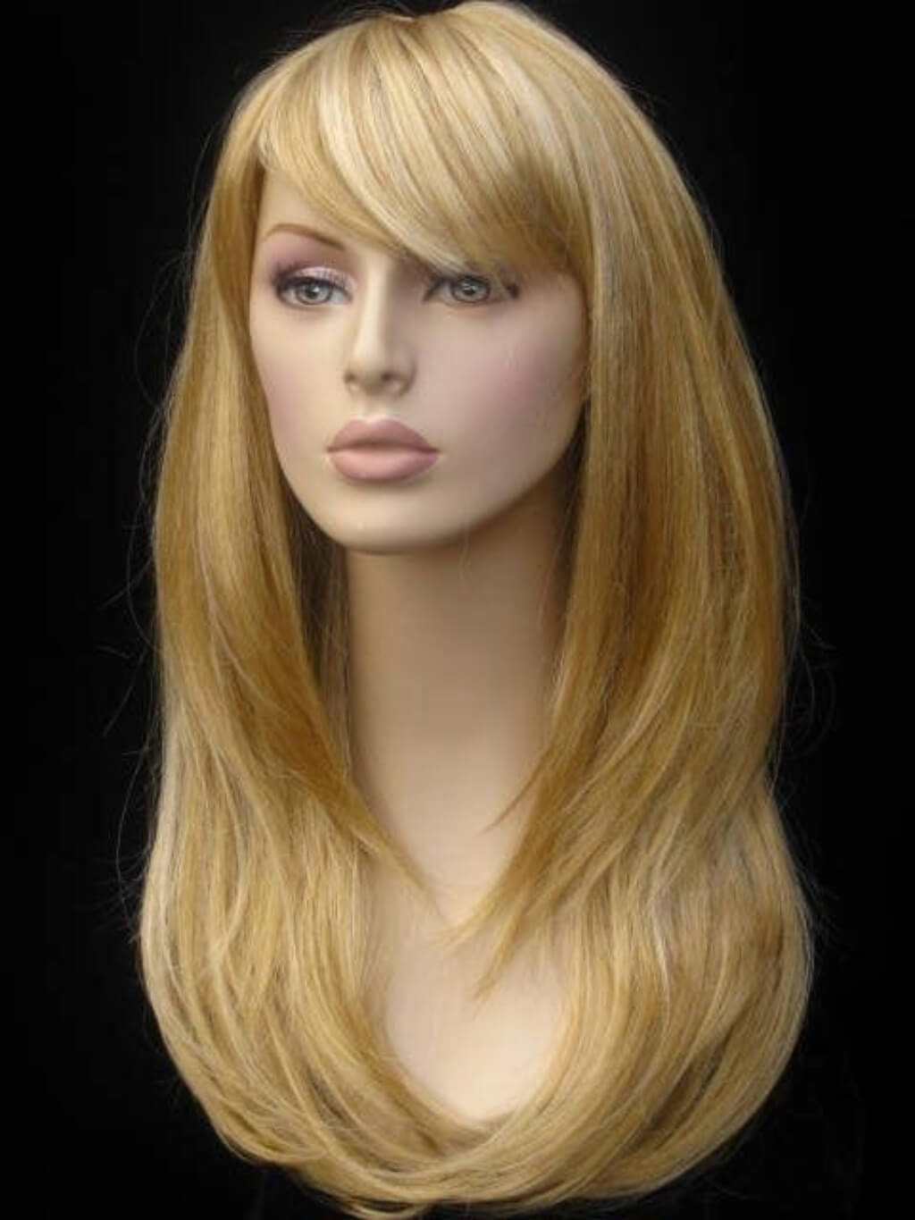 Blonde wig on a mannequin head against a black background. Long blonde wig, face framing with long, side-sweeping fringe: Ashley golden blonde 24BH613