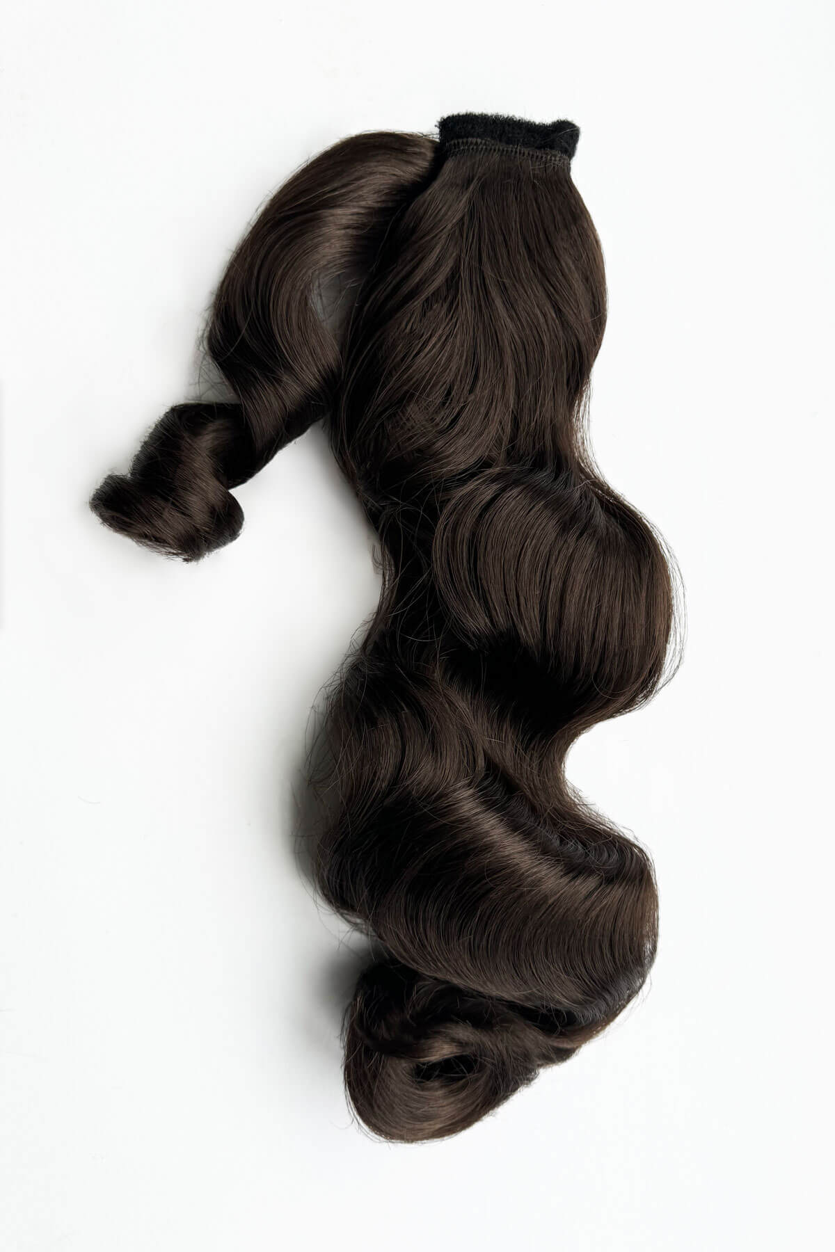 Brown hair extensions on a white background. Retro style ponytail hairpiece, long with vintage waves: Arabella dark chocolate brown 6