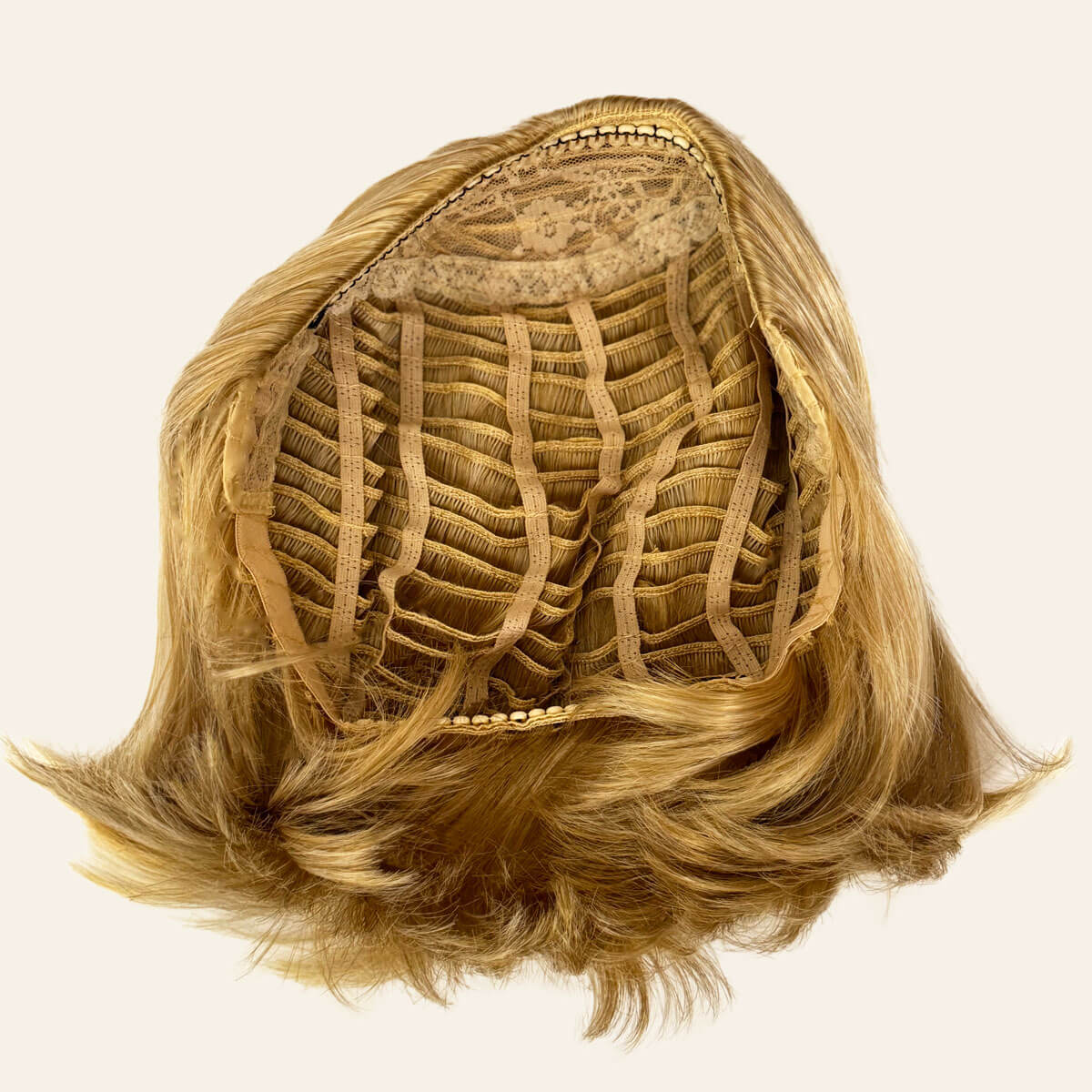 Blonde half wig on a beige background. Bob half wig hairpiece, Flexihair: Amelie honey blonde 24BH613