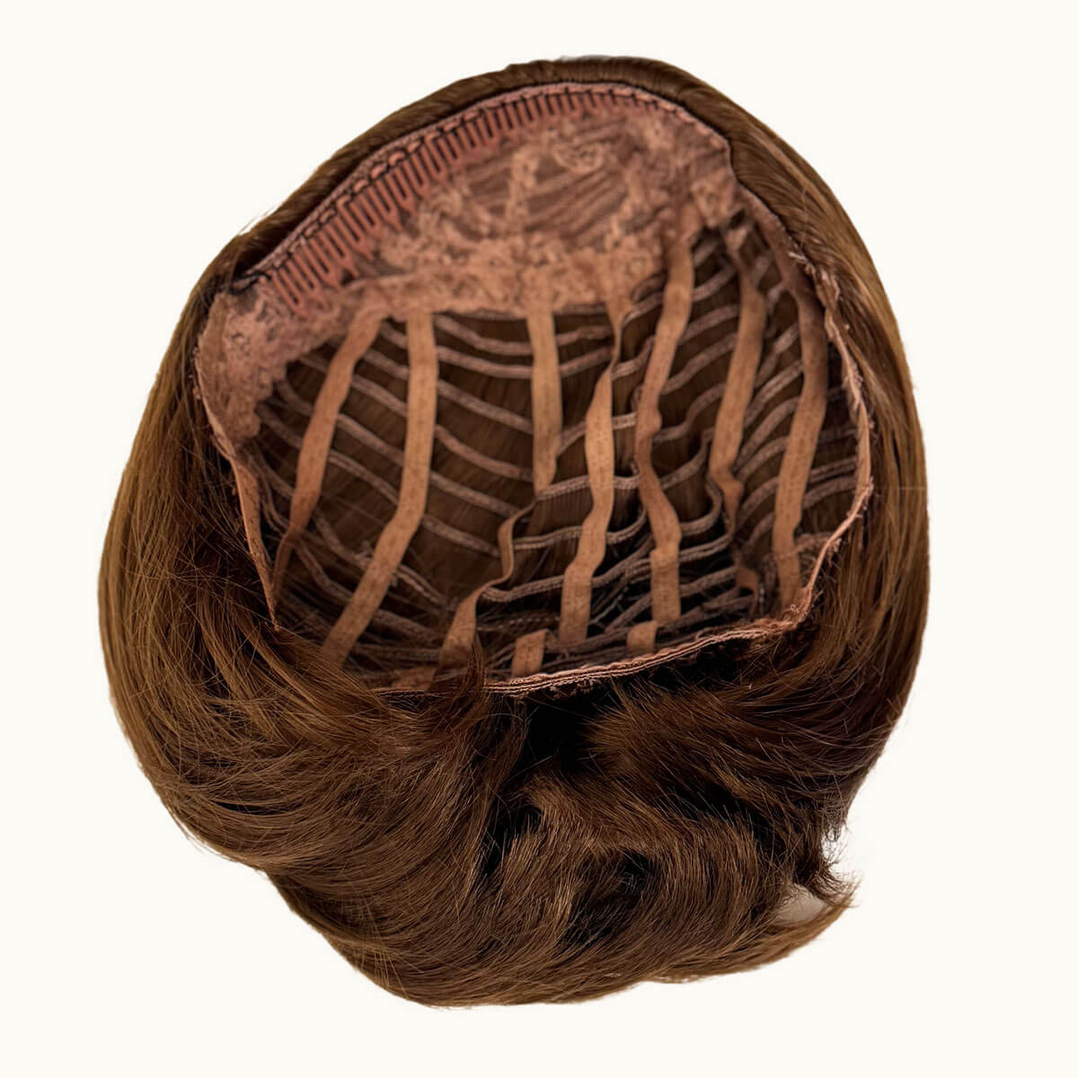 Brown hairpiece with a clip on a white background. Bob half wig hairpiece, heat styleable: Amelie light chocolate brown 12