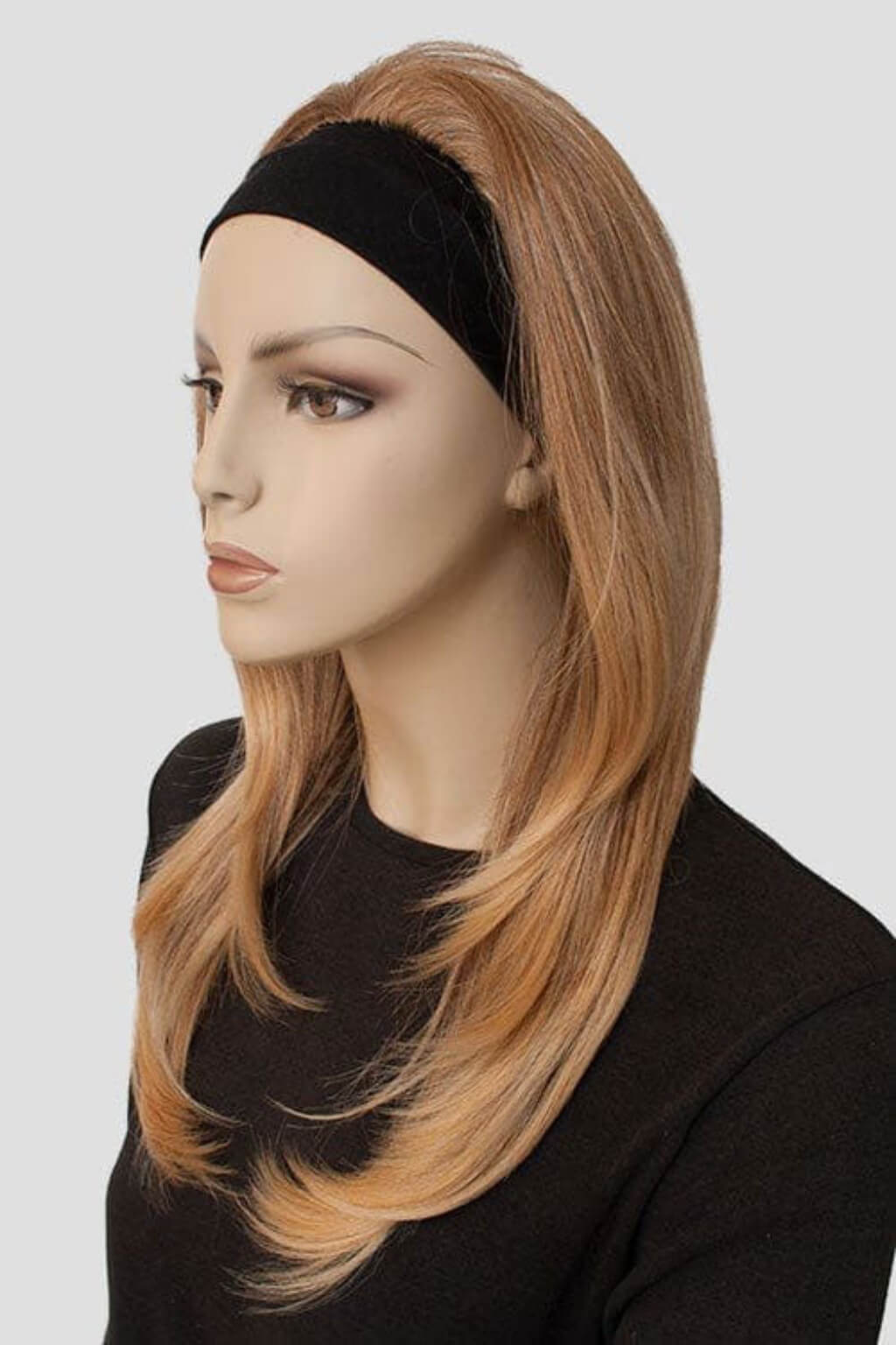 Mannequin head with a brown wig on a white background. Brown half wig hairpiece (3/4 wig), gently layered: Briar