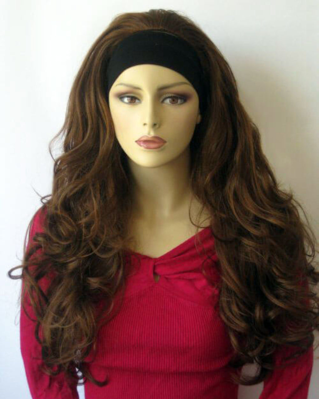Mannequin head with long brown wig and black headband on a white background. Light auburn half wig hairpiece (3/4 wig), loose curls: Breanna