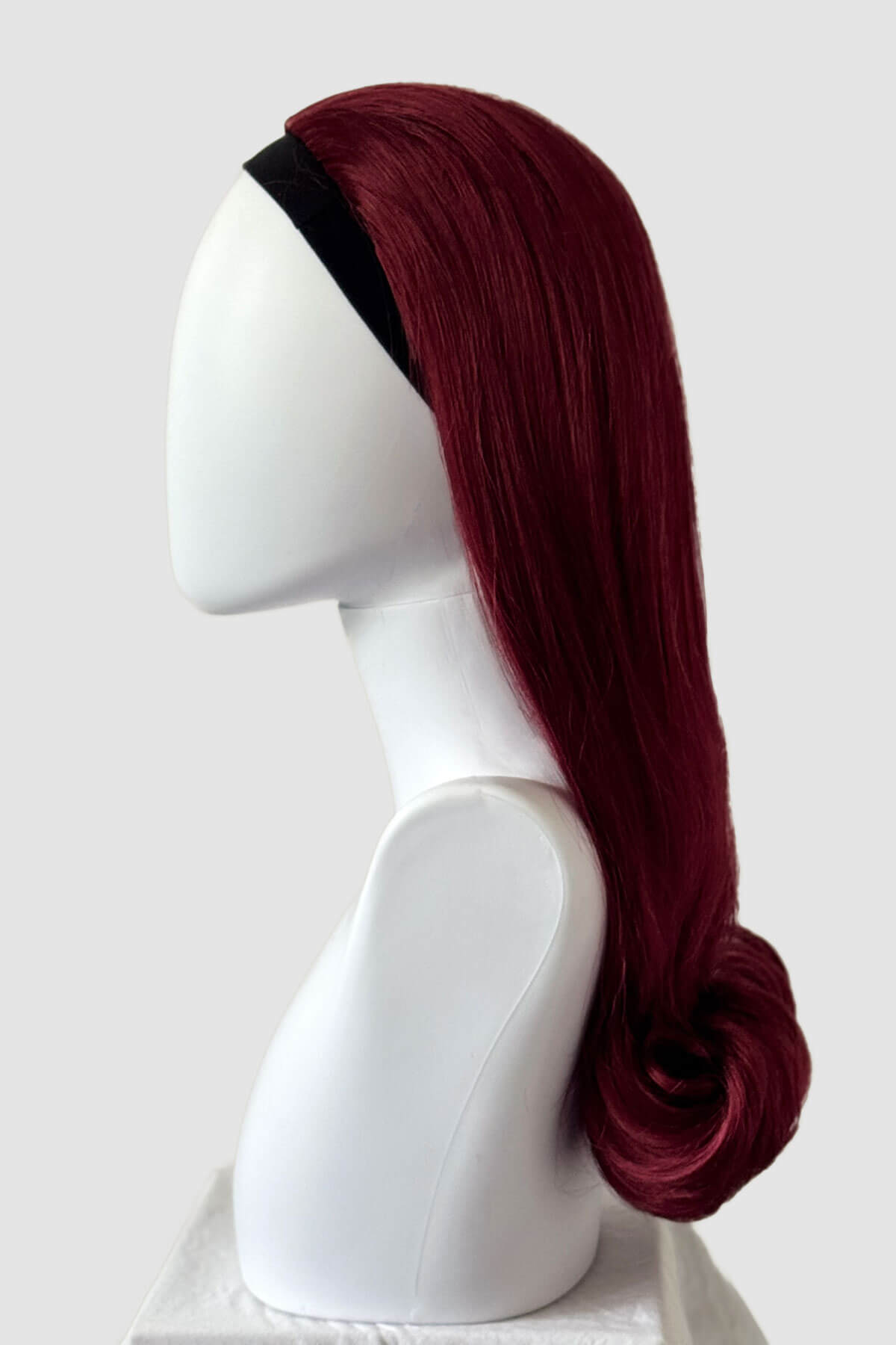 Red wig on a white background. 1960s Retro high crown, half wig hairpiece, long with hair flip: Priscilla cherry red 39
