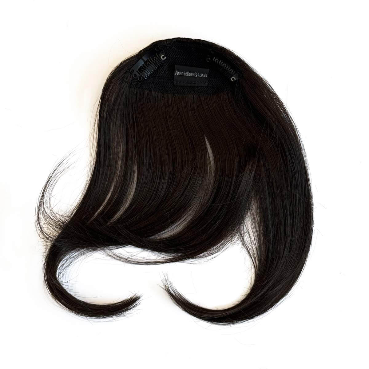 Black hair extension on a white background. Clip in fringe hairpiece/clip-in curtain bangs, with long, face framing wisps: Sabrina dark brown 4