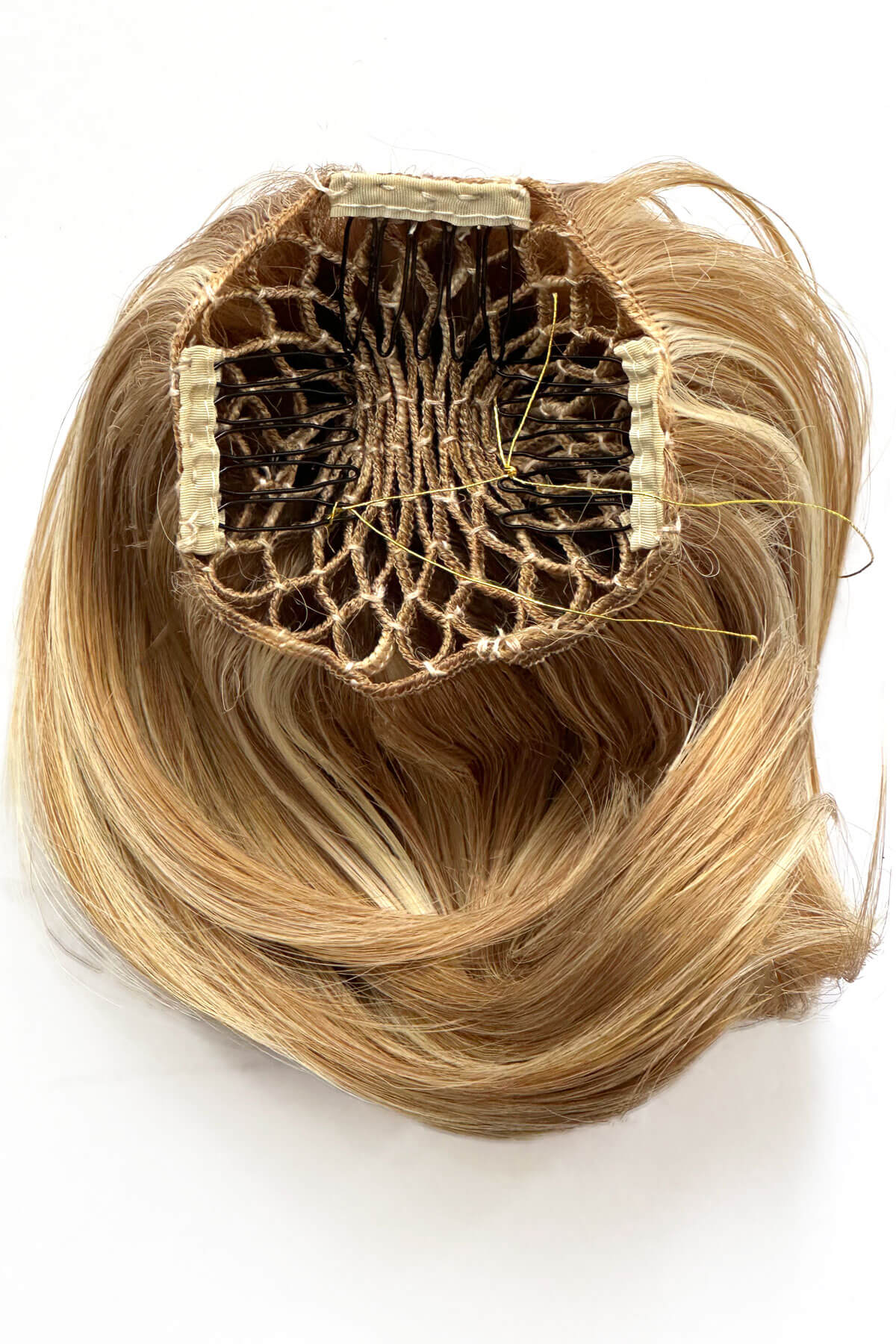 Blonde hair extension with a clear base on a white background. Beehive hairpiece hair height booster, Flexihair: Pixi blonde 24BH613