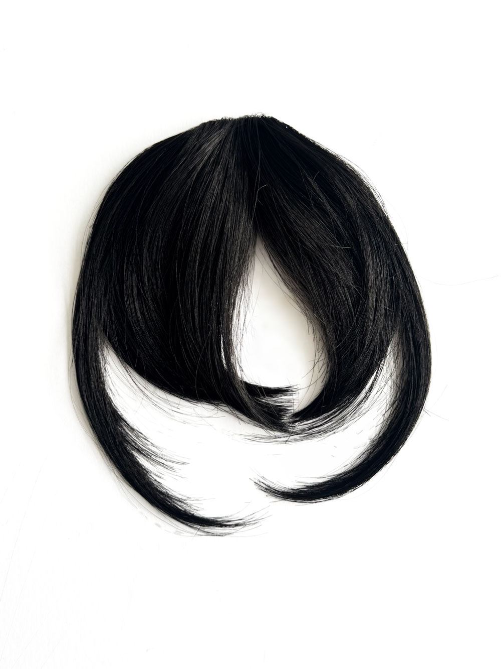 Clip in fringe hairpiece/clip-in bangs, gently feathered with face framing whisps: Delia black 1B