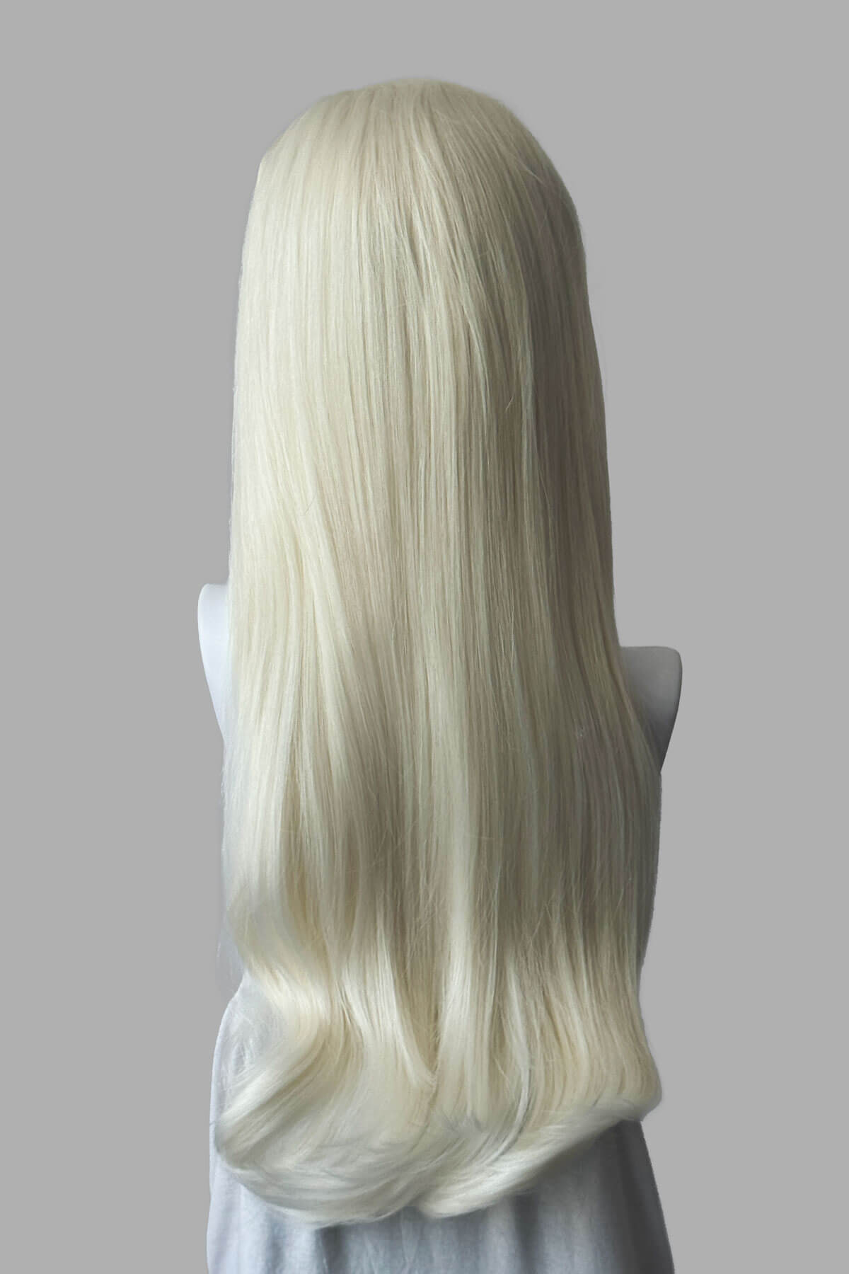 Long, platinum blonde half wig on a plain background. Kate - Heat Styleable Extra Long, Gentle Wave Half Wig  dark platinum blonde 1001