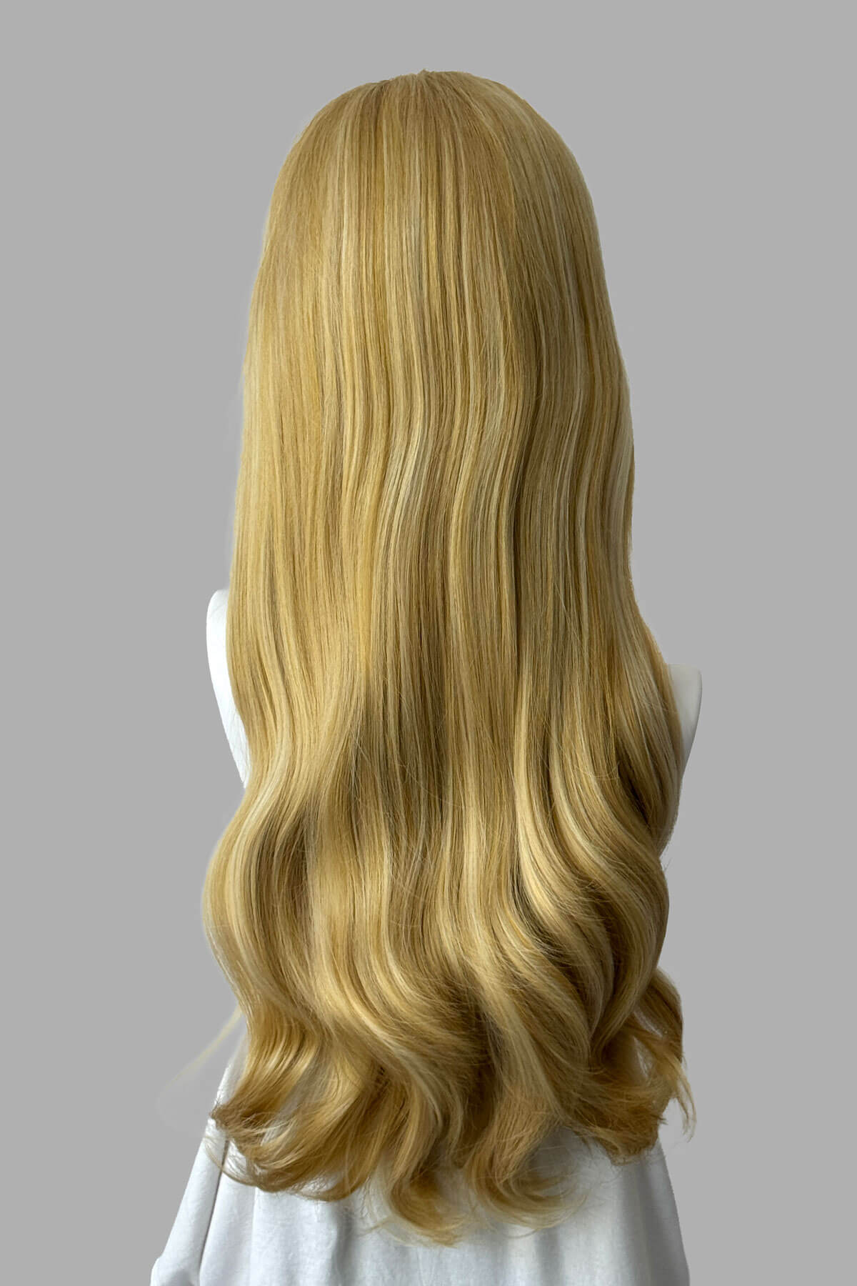 Mannequin head with warm blonde wig on a plain background. Kate - Heat Styleable Extra Long, Gentle Wave Half Wig  blonde 24BH613