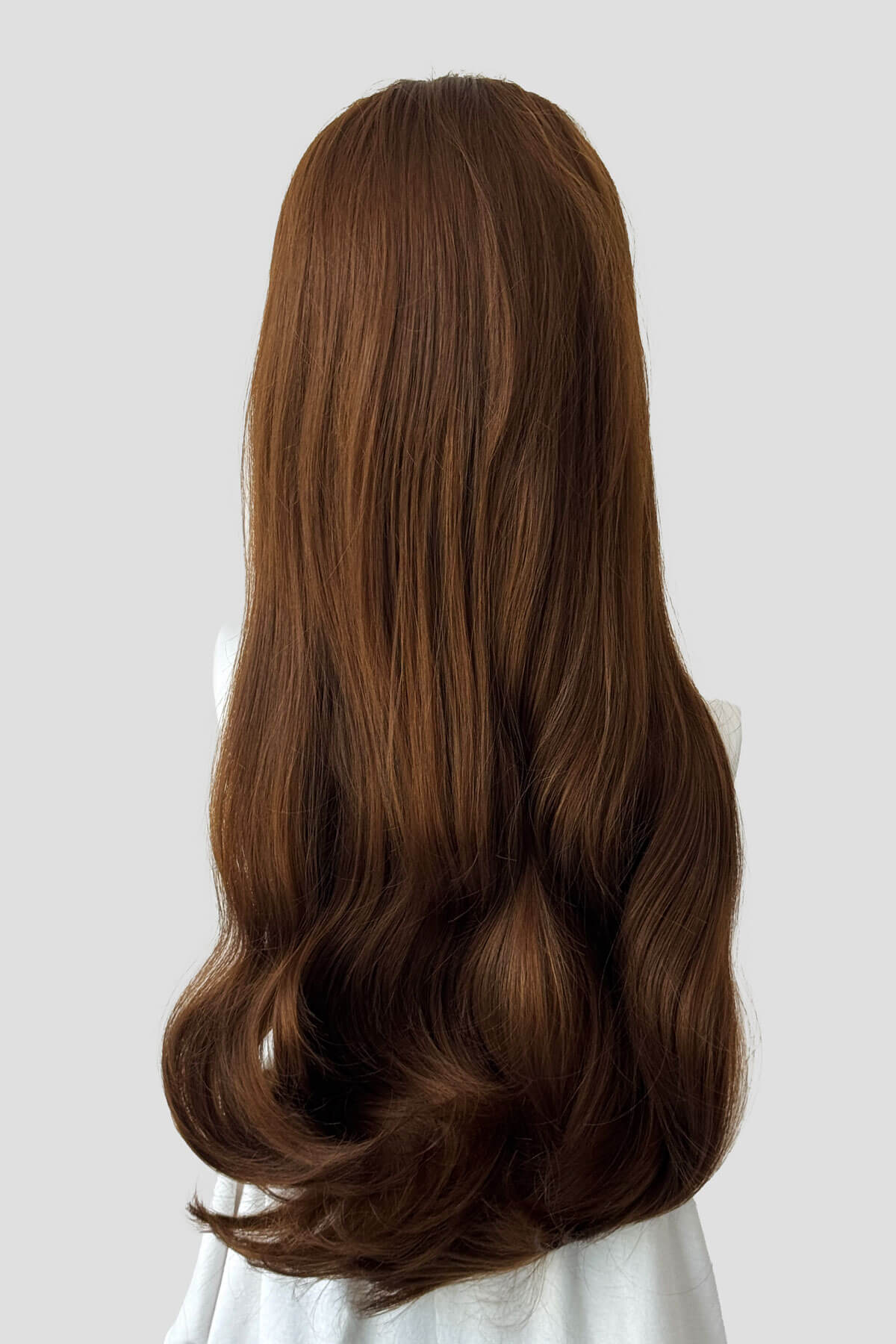 Long, light brown wig on a plain background. Kate - Heat Styleable Extra Long, Gentle Wave Half Wig  dark light brown 12