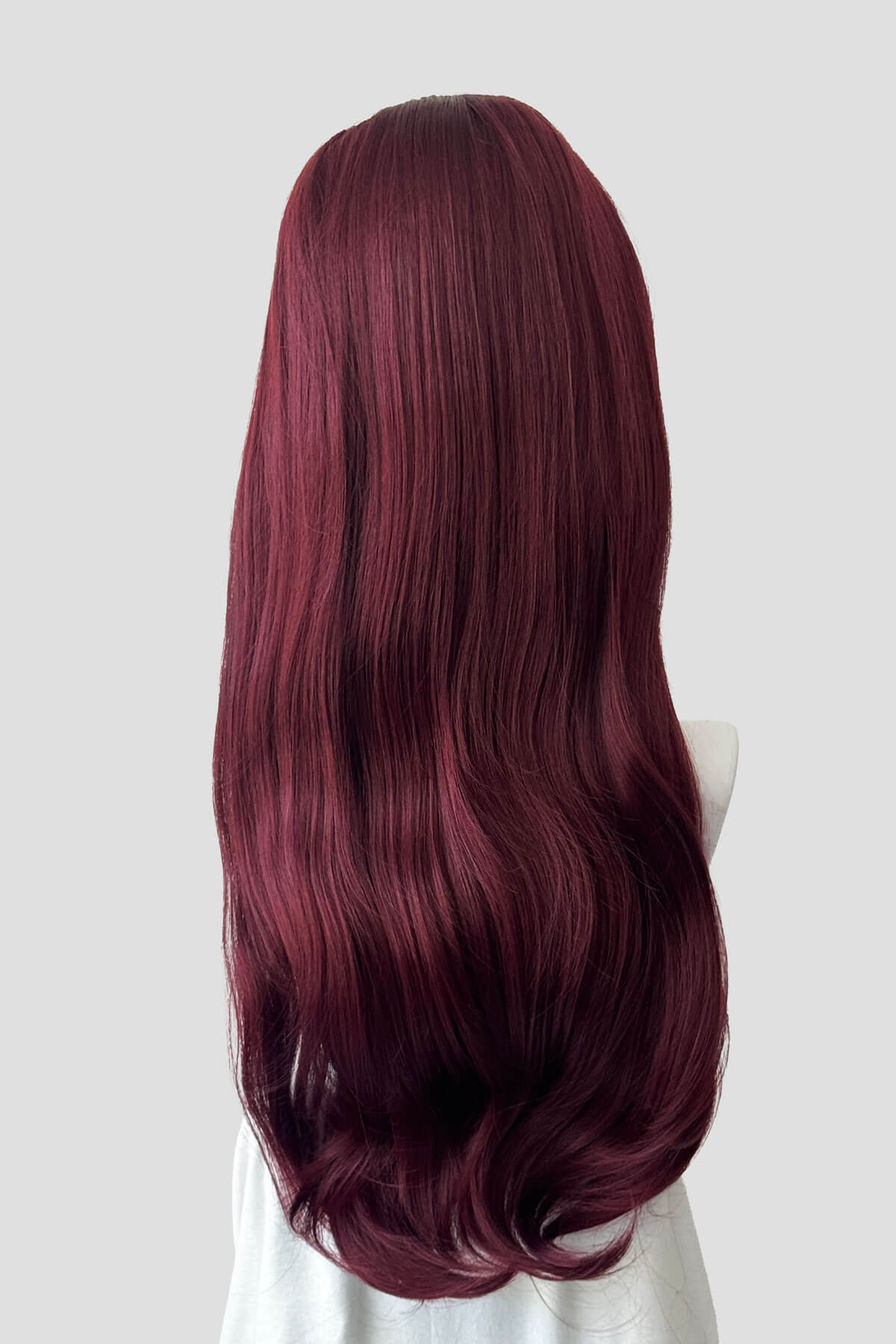 Mannequin head with long, wavy, burgundy hair on a plain background. Kate - Heat Styleable Extra Long, Gentle Wave Half Wig  red 39