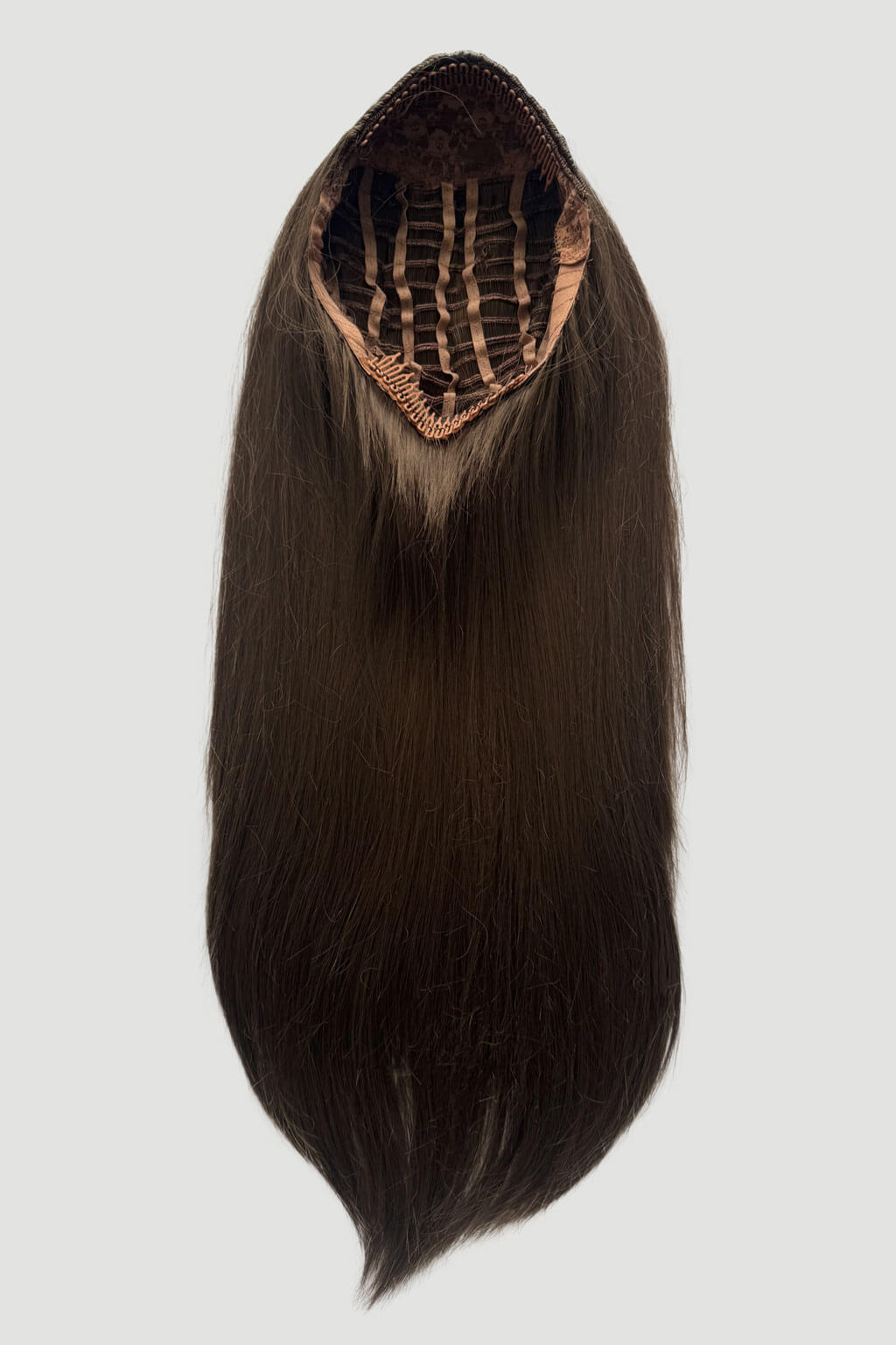 Brown hair extension with a clip on a light gray background. 1960s style hair, high crown long straight half wig: Andrea mocha brown 10