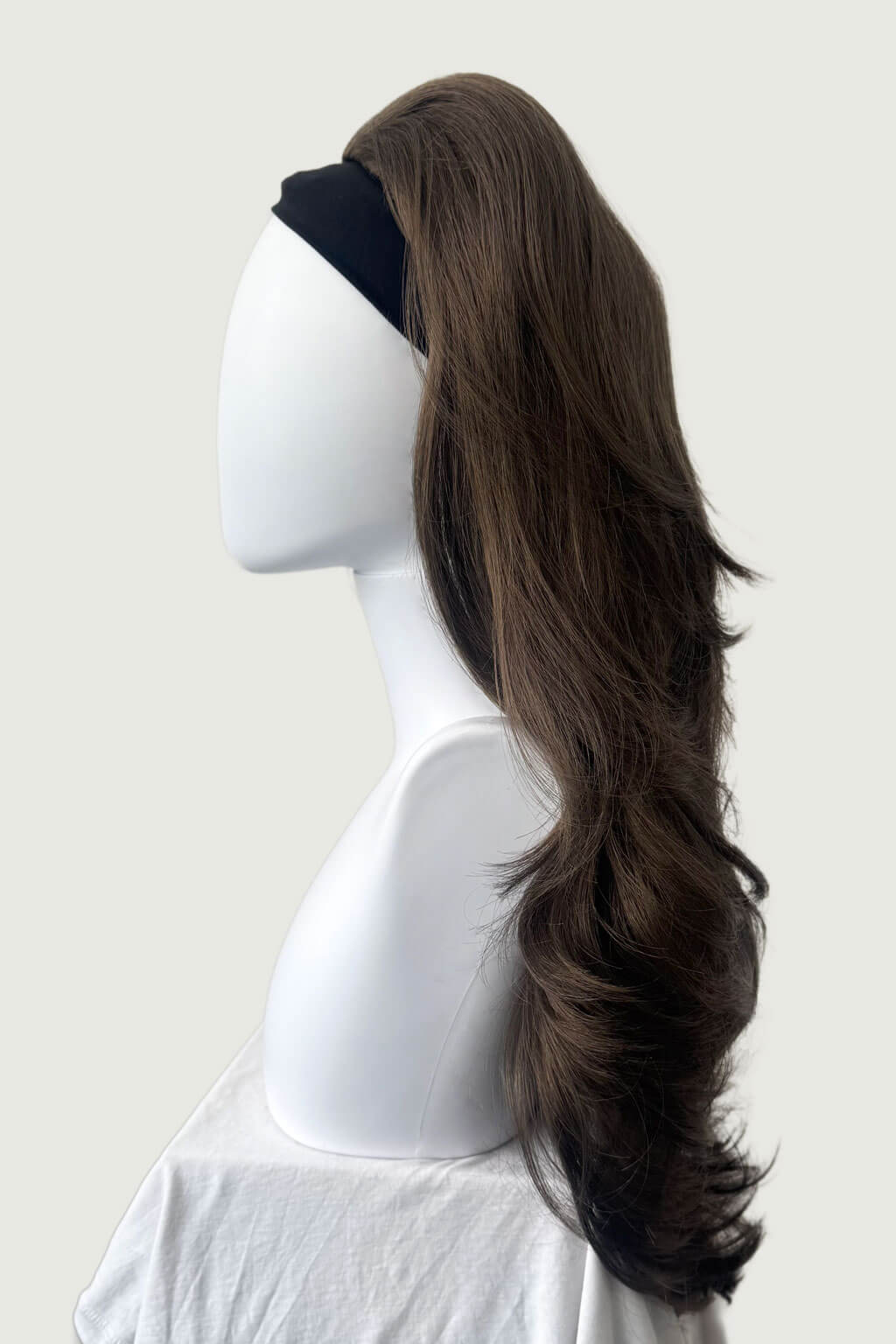 Mannequin head with long brown hair styled in a ponytail on a plain background - High crown long, layered half wig and volume ring: Helena mocha brown 10 