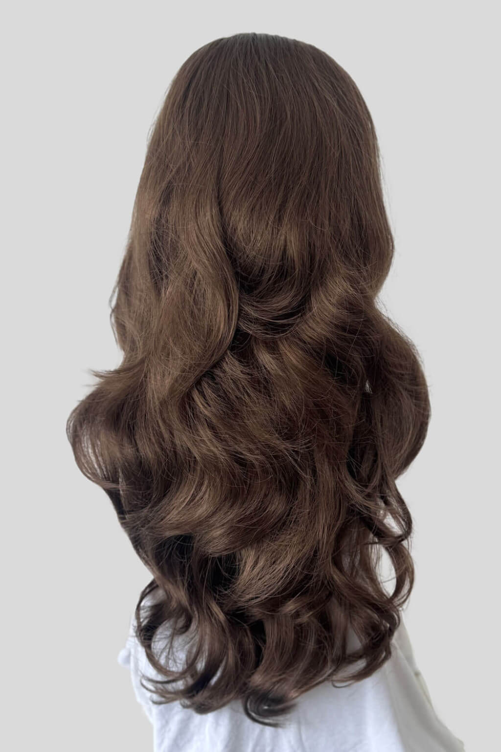 Long, wavy brown hair on a white background. High crown long, wavy half wig and volume ring: Bardot mocha brown 10