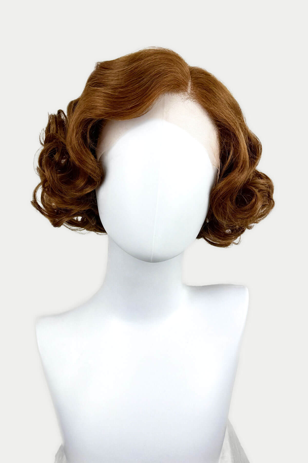 Auburn brown wavy wig on a mannequin head against a white background. Auburn pinup wig, lace front, vintage style: Tawney