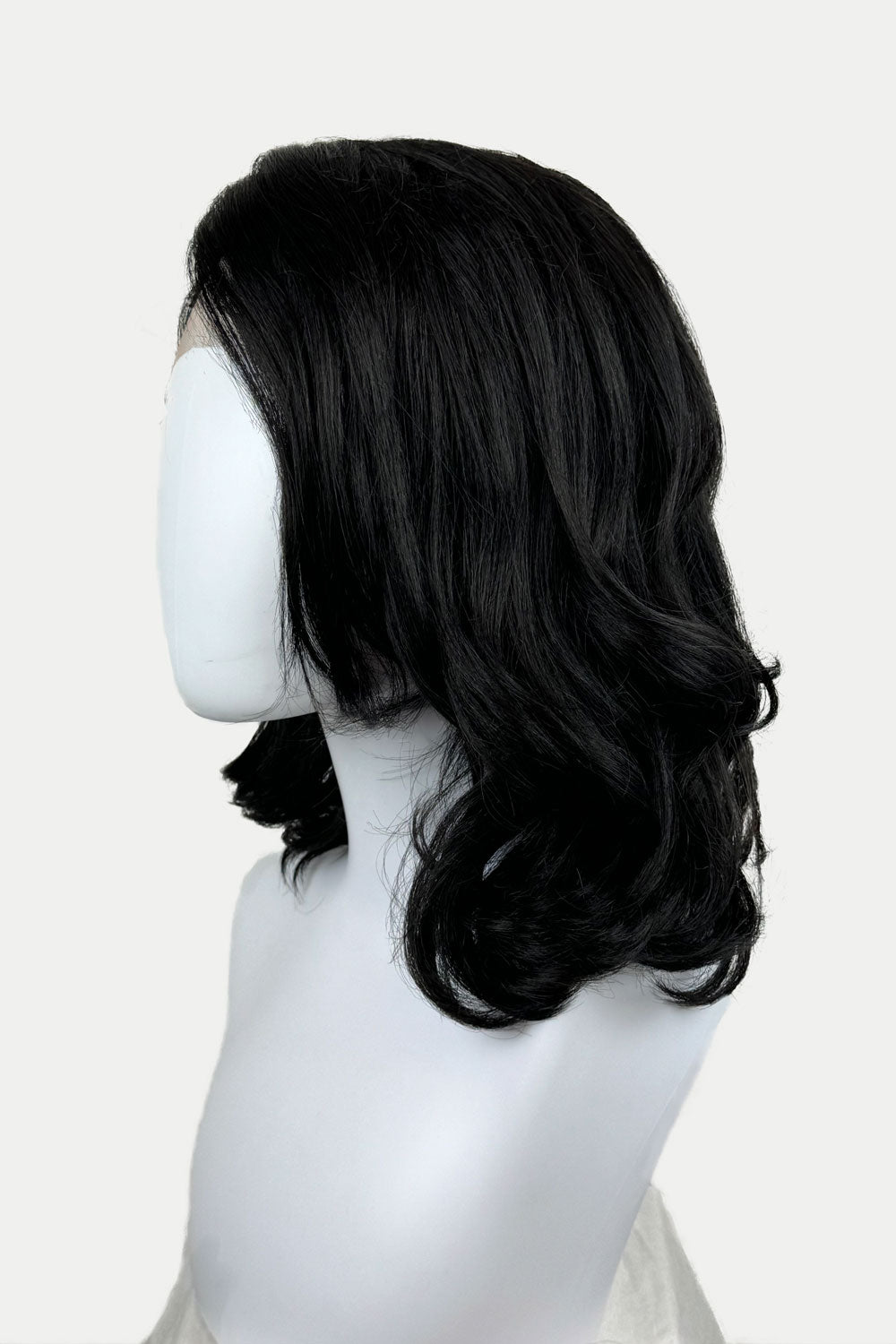 Black shoulder length long bob (lob) lacefront wig with side sweeping fringe/bangs: Amaris from the side on a mannequin