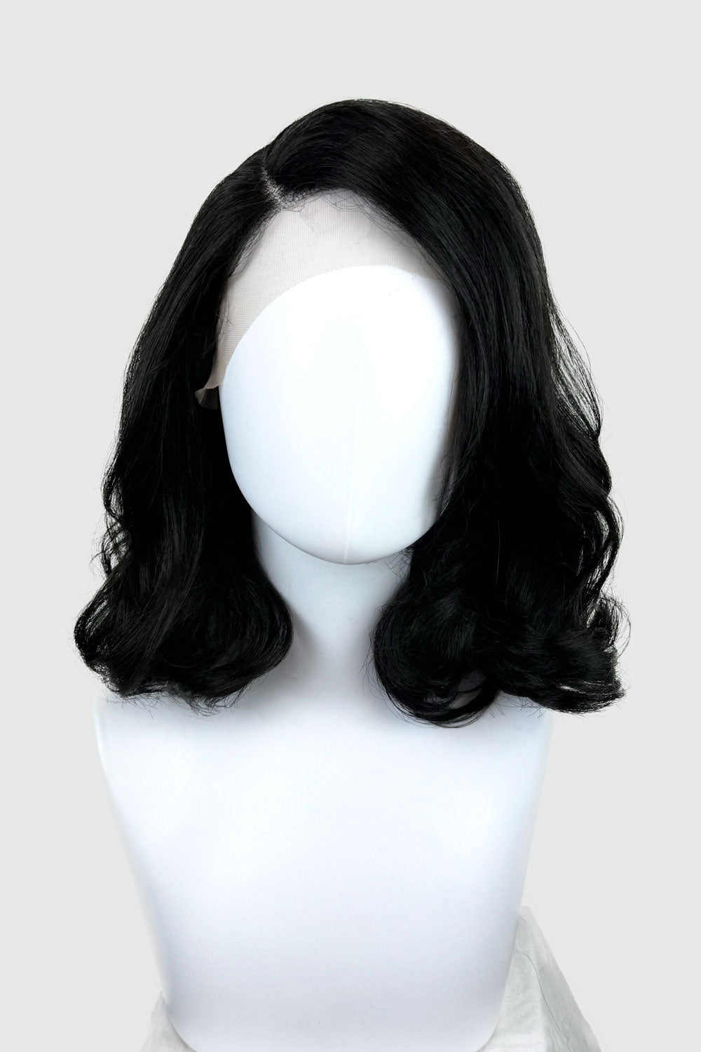A mid-length black long bob lacefront wig with side sweeping fringe displayed on a mannequin head. Black shoulder length long bob (lob) lacefront wig with side sweeping fringe/bangs: Amaris