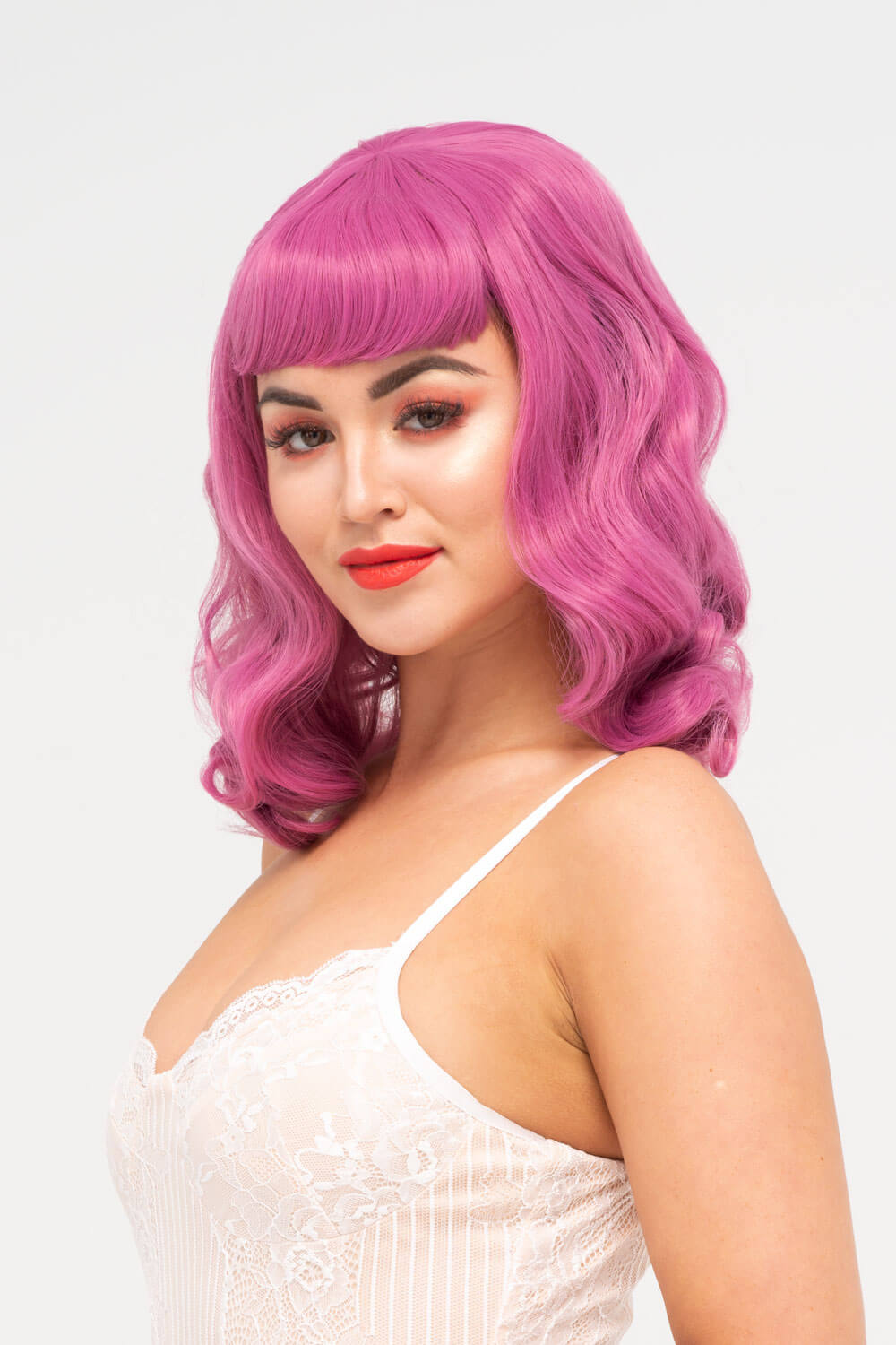Pink pinup style wig, with finger waves and a short fringe, 1950s style: Stevie 2520J
