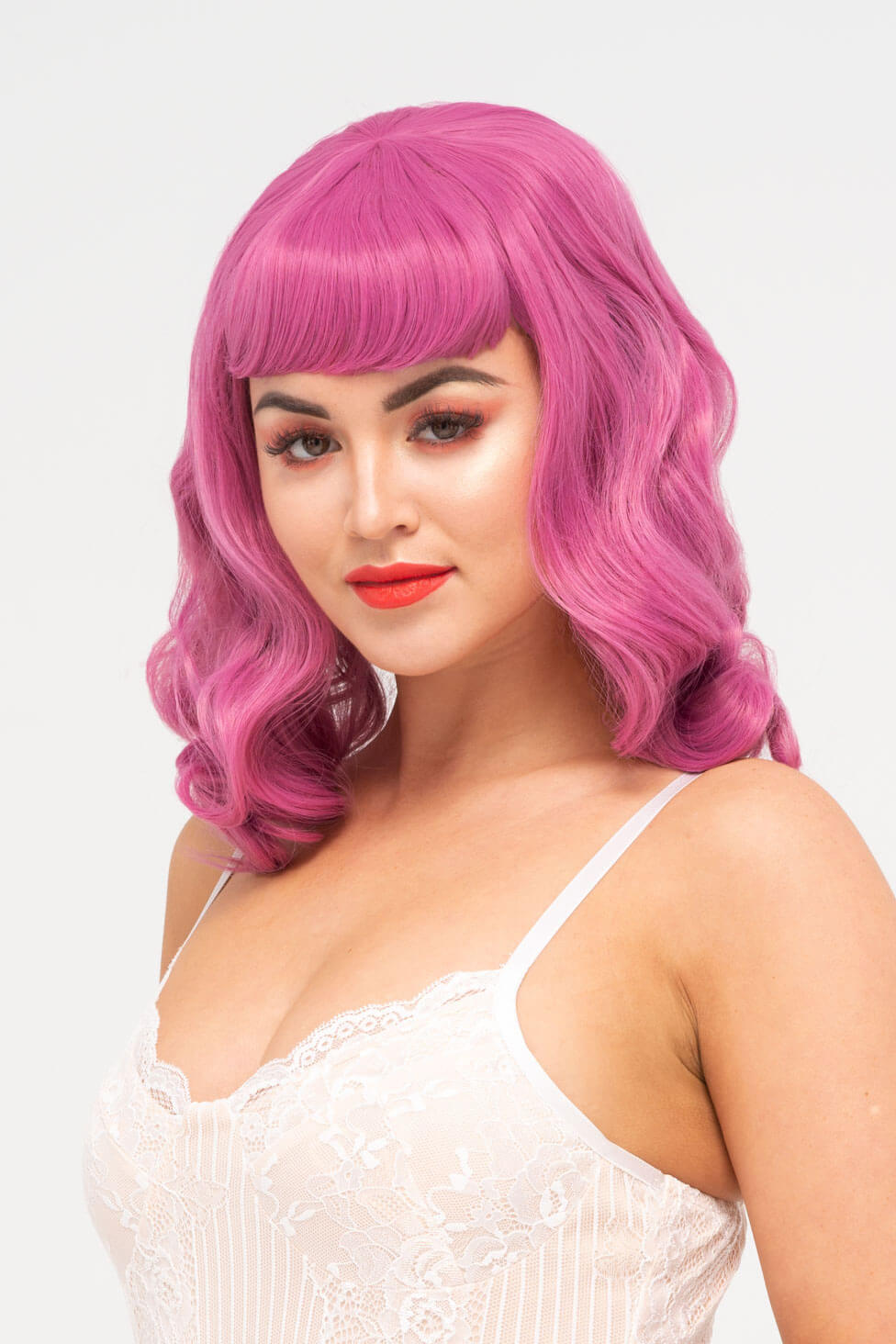 Pink pinup style wig, with finger waves and a short fringe, 1950s style: Stevie 2520J