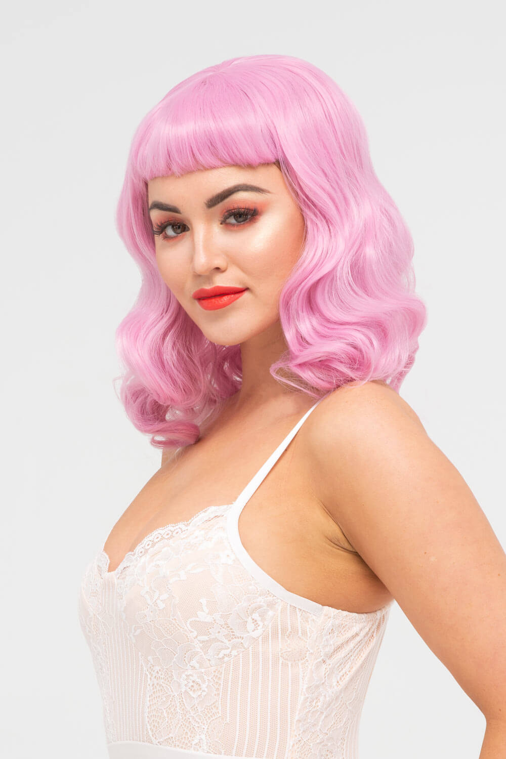 Pink pinup style wig, with finger waves and a short fringe, 1950s style: Stevie 2614J