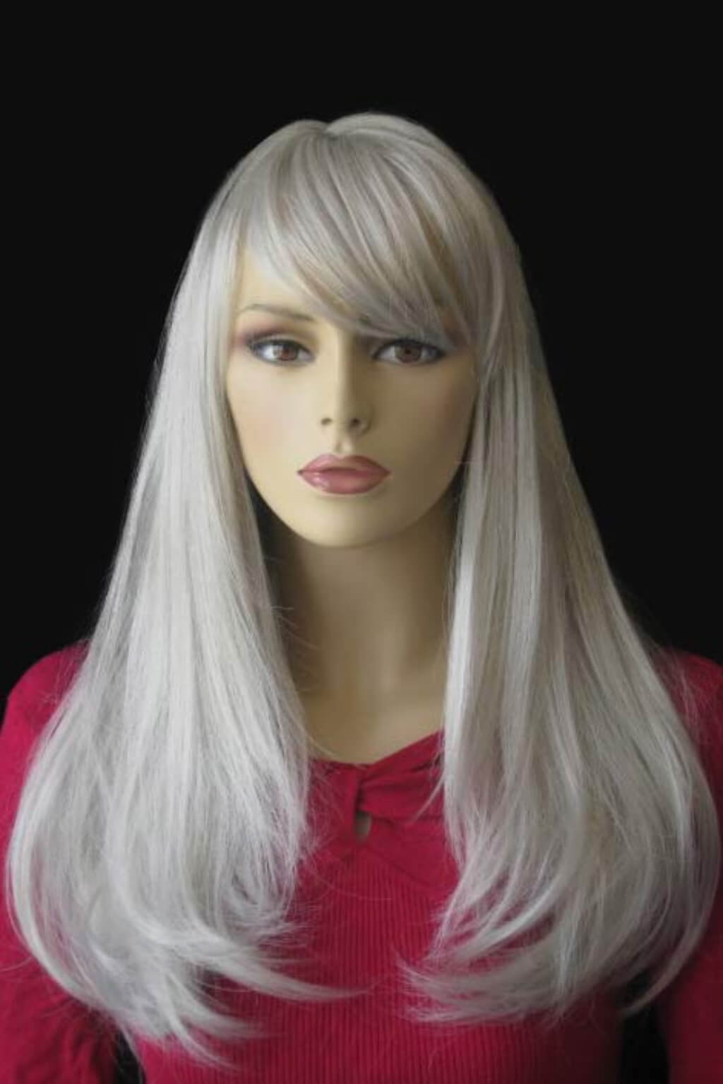 Mannequin head with long white wig on a black background. Long silver/grey wig in razor cut, face framing style: London